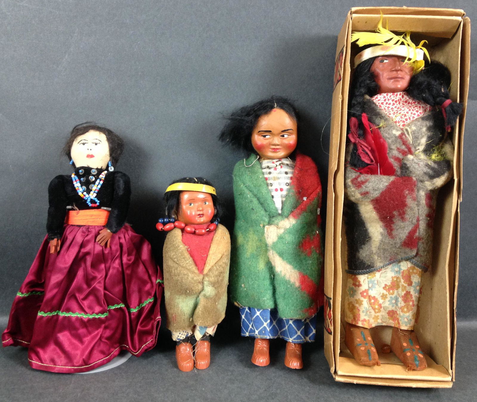 LOT OF (4) INDIAN DOLLS INCLUDING (3) SKOOKUMS. (1 of 1)