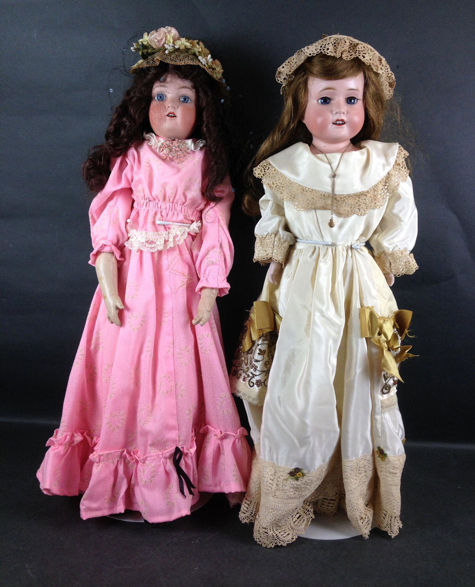 (2) 25" BISQUE SHOULDER HEAD DOLLS ON KID BODIES -: (2) 25" BISQUE SHOULDER HEAD DOLLS ON KID BODIES - WAGNER & ZETZSCHE WITH HUMAN HAIR WIG, SET GLASS EYES, OPEN MOUTH WITH TEETH AND COMPOSITION LOWER ARMS AND LEGS WEARING PINK COTTON DRESS. AND MORIM