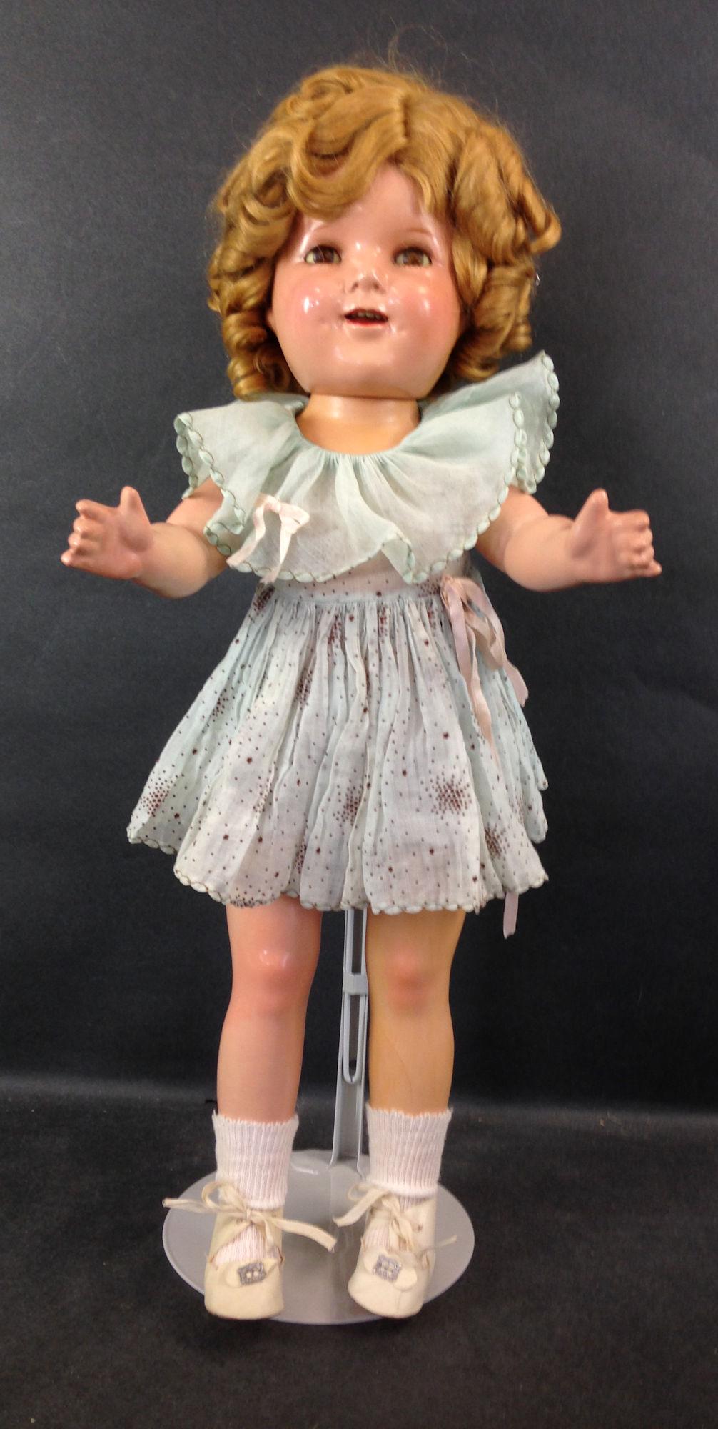 20" IDEAL COMPOSITION SHIRLEY TEMPLE DOLL. MOHAIR WIG: 20" IDEAL COMPOSITION SHIRLEY TEMPLE DOLL. MOHAIR WIG IN ORIGINAL SET, SLEEP EYES, OPEN MOUTH WITH TEETH, ON FIVE-PIECE COMPOSITION BODY. DOLL WEARS ORIGINAL UNTAGGED DRESS FROM "CURLY TOP", UNDERCLOT