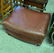 WORN LEATHER OTTOMAN