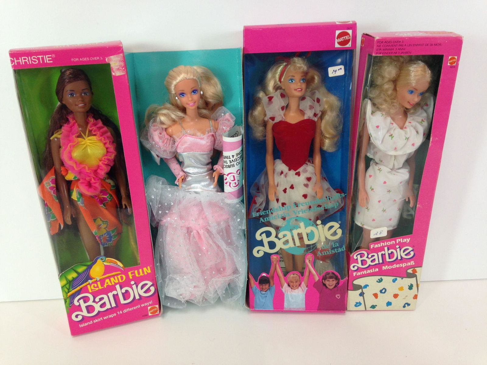 (4) NRFB VINTAGE BARBIES INCLUDING MADE FOR THE FOREIGN (1 of 2)