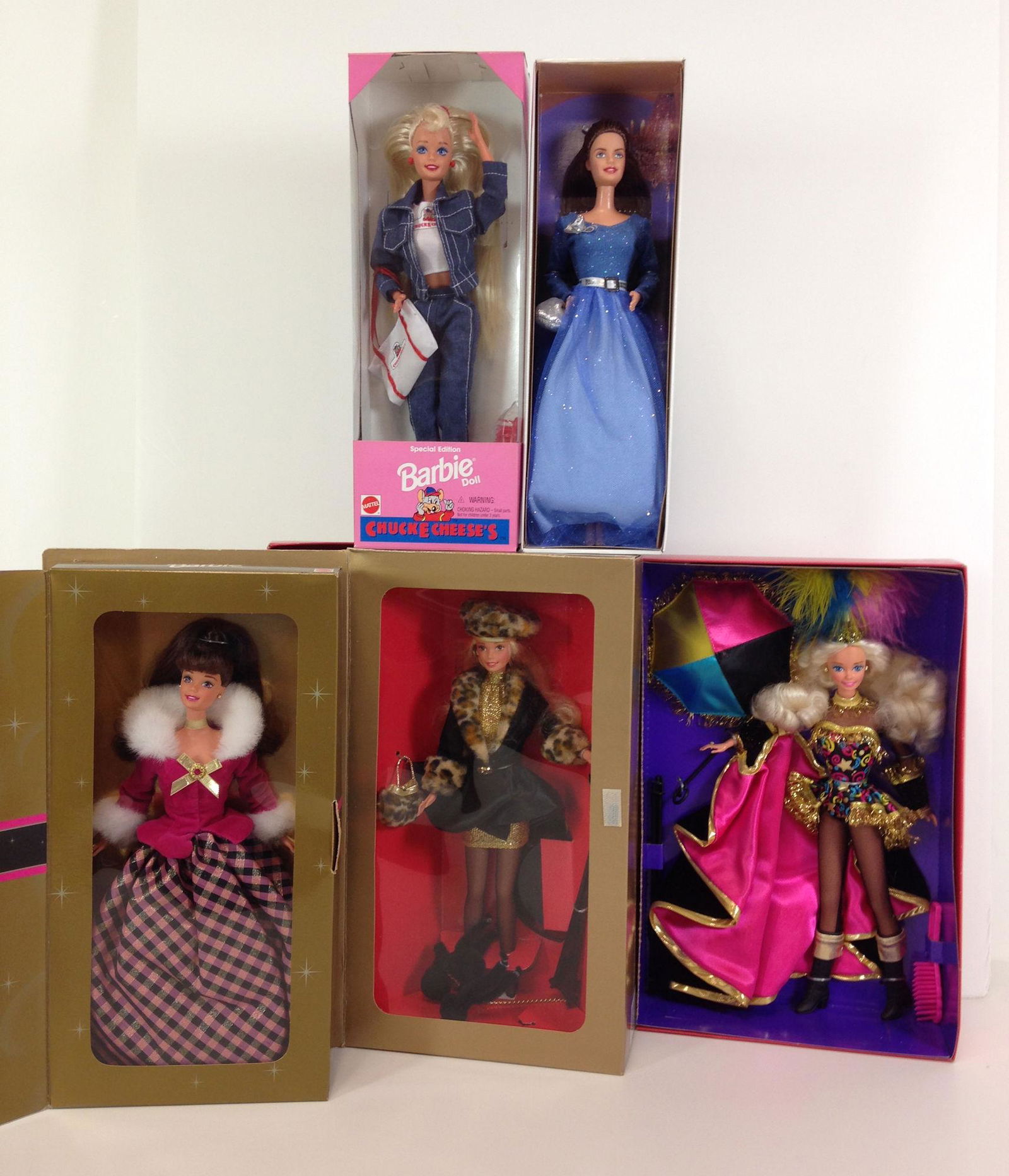 (5) NRFB BARBIES INCLUDING 40TH ANNIVERSARY "LITTLE: (5) NRFB BARBIES INCLUDING 40TH ANNIVERSARY "LITTLE DEBBIE" SERIES IV, "CHUCK E CHEESE", "WINTER RHAPSODY", "SHOPPING CHIC" AND "CIRCUS STAR".