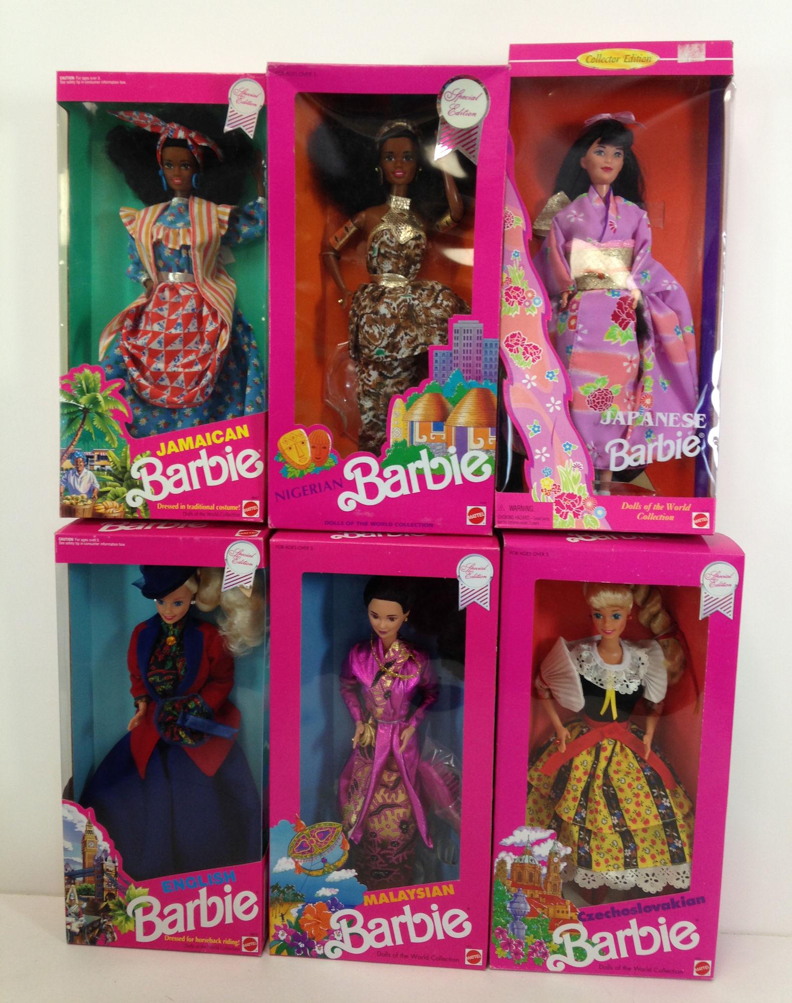 (6) NRFB COUNTRY BARBIES INCLUDING "JAPANESE",: (6) NRFB COUNTRY BARBIES INCLUDING "JAPANESE", "MALAYSIAN", "CZECHOSLOVAKIAN", "ENGLISH", "NIGERIAN" AND "JAMAICAN".