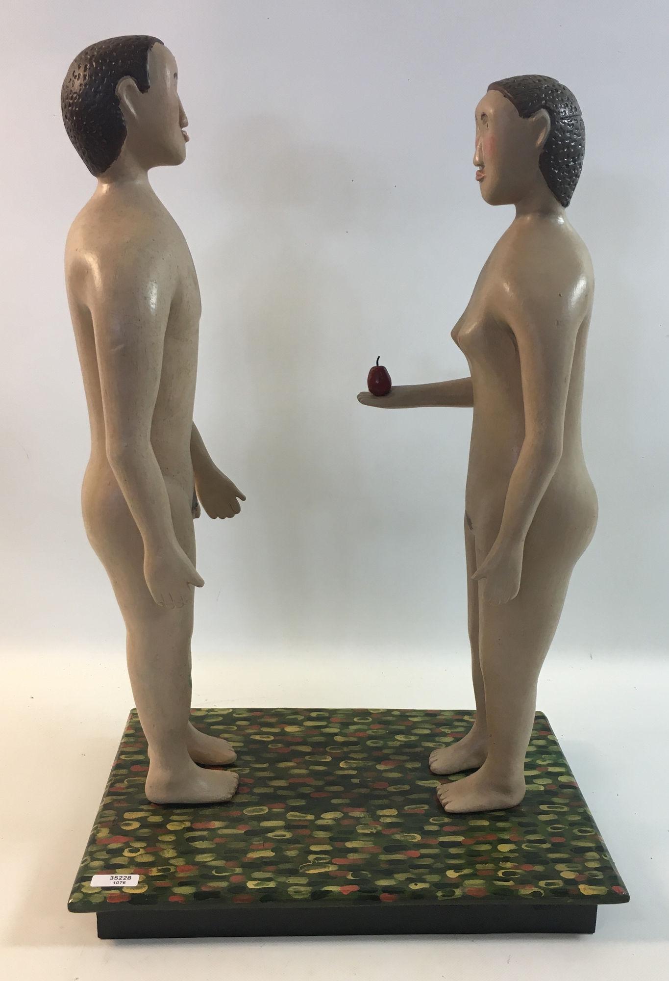 WOODEN FOLK ART FIGURES OF ADAM AND EVE MOUNTED ON A: WOODEN FOLK ART FIGURES OF ADAM AND EVE MOUNTED ON A WOODEN BASE 16" TALL