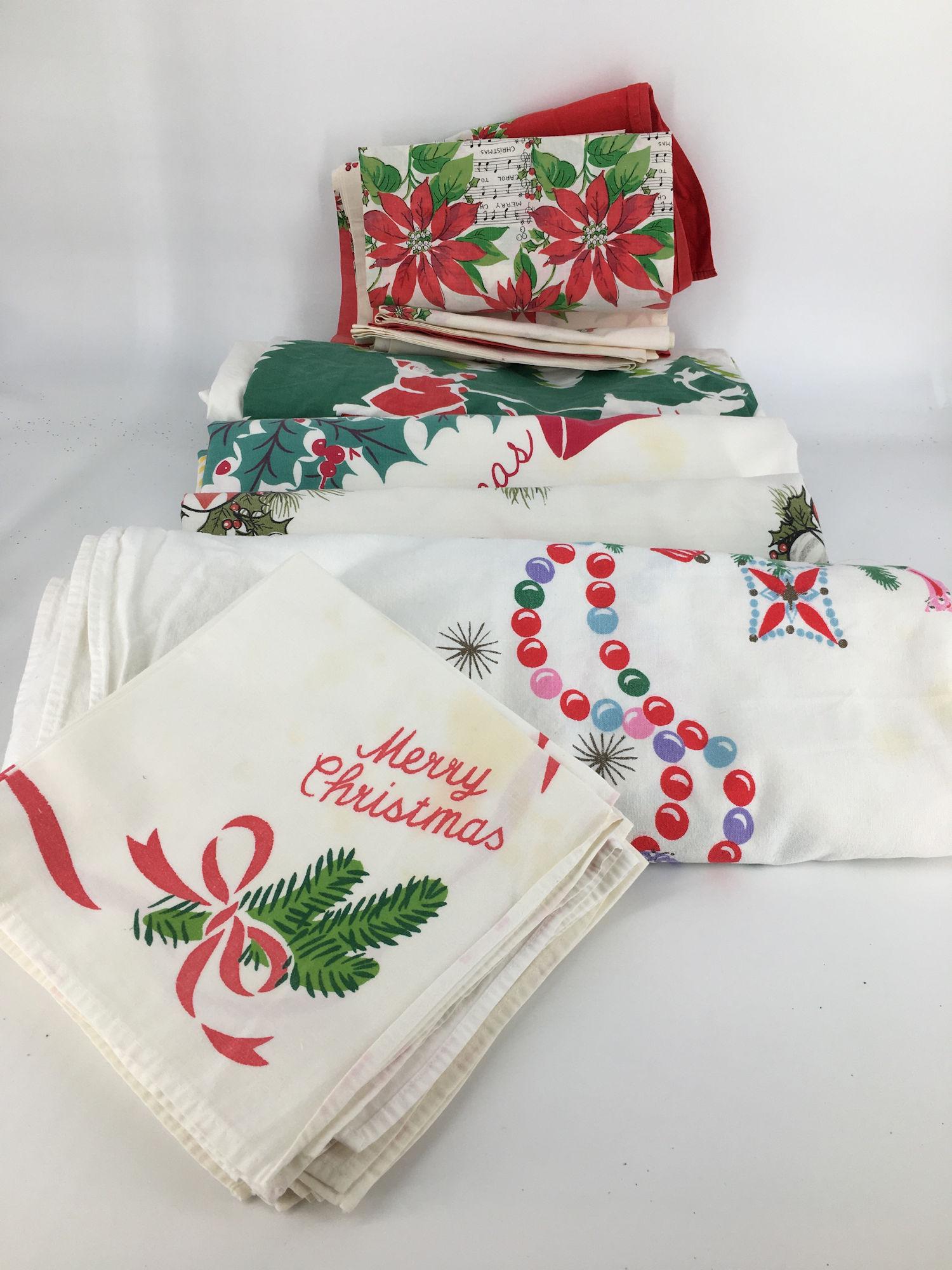 BOX LOT CHRISTMAS INCLUDING 4 LARGE TABLECLOTHS WITH 10: BOX LOT CHRISTMAS INCLUDING 4 LARGE TABLECLOTHS WITH 10 CLOTH NAPKINS