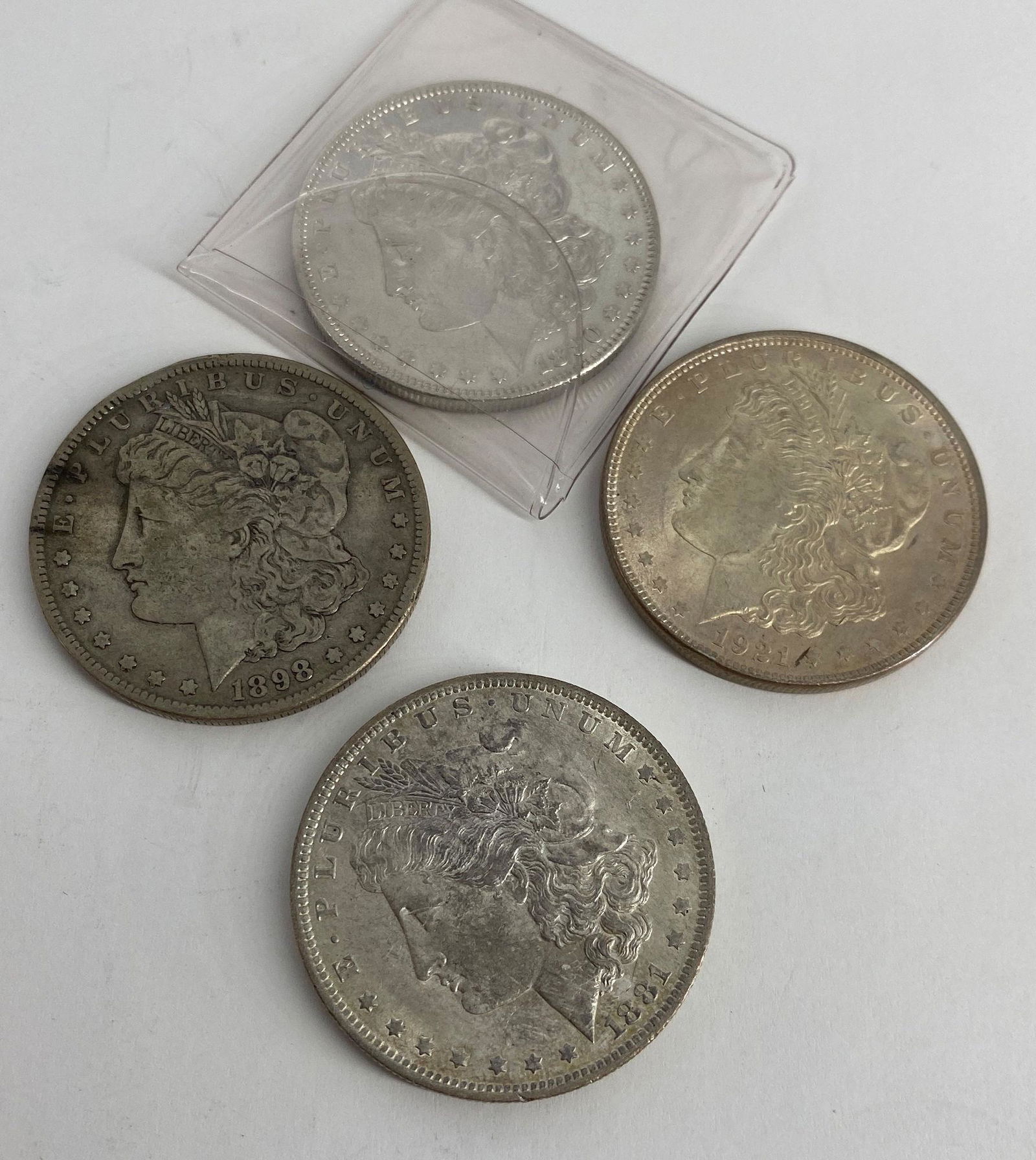 FOUR U.S. SILVER DOLLARS (1 of 9)