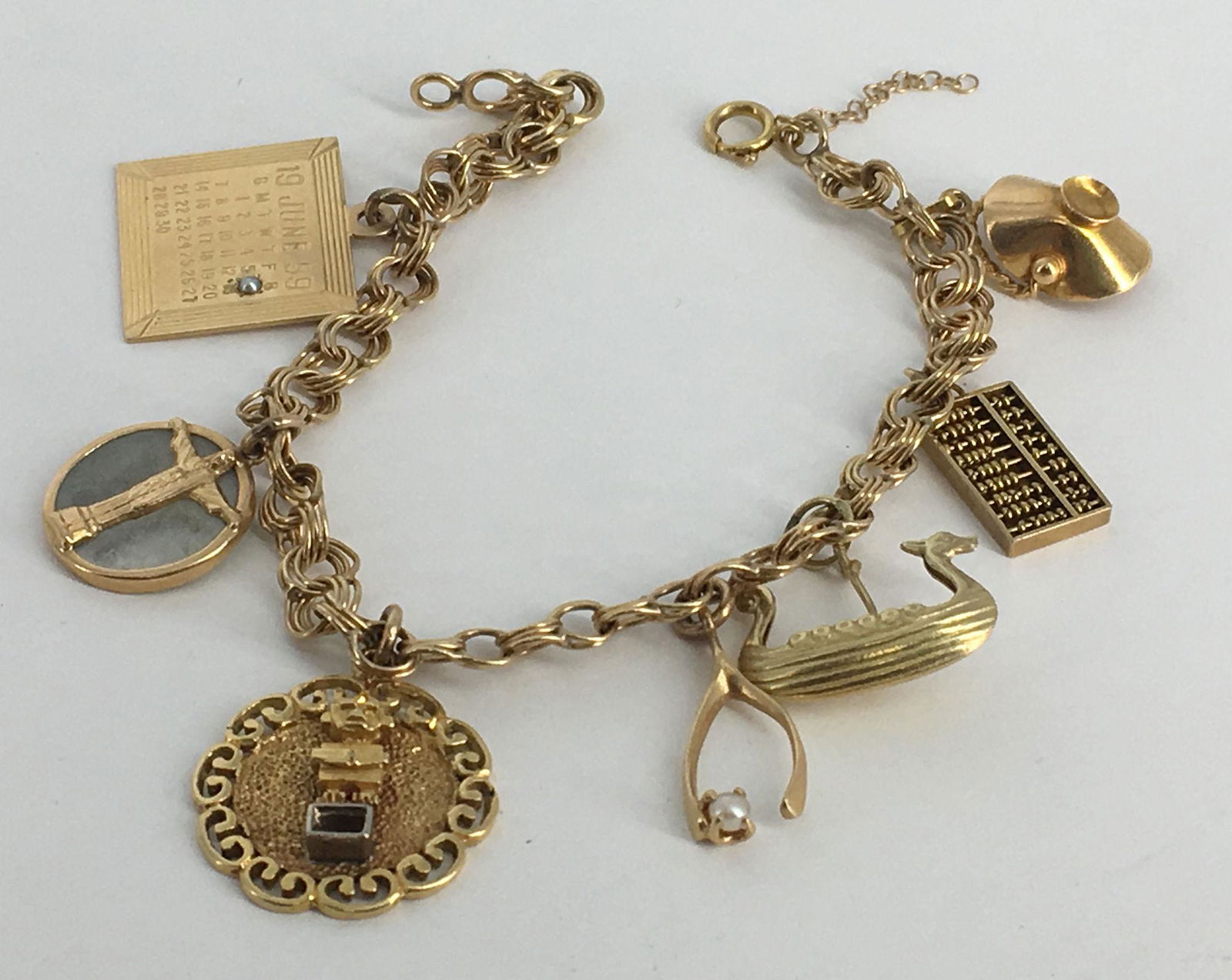 VINTAGE 14KT GOLD CHARM BRACELET (1 of 6)