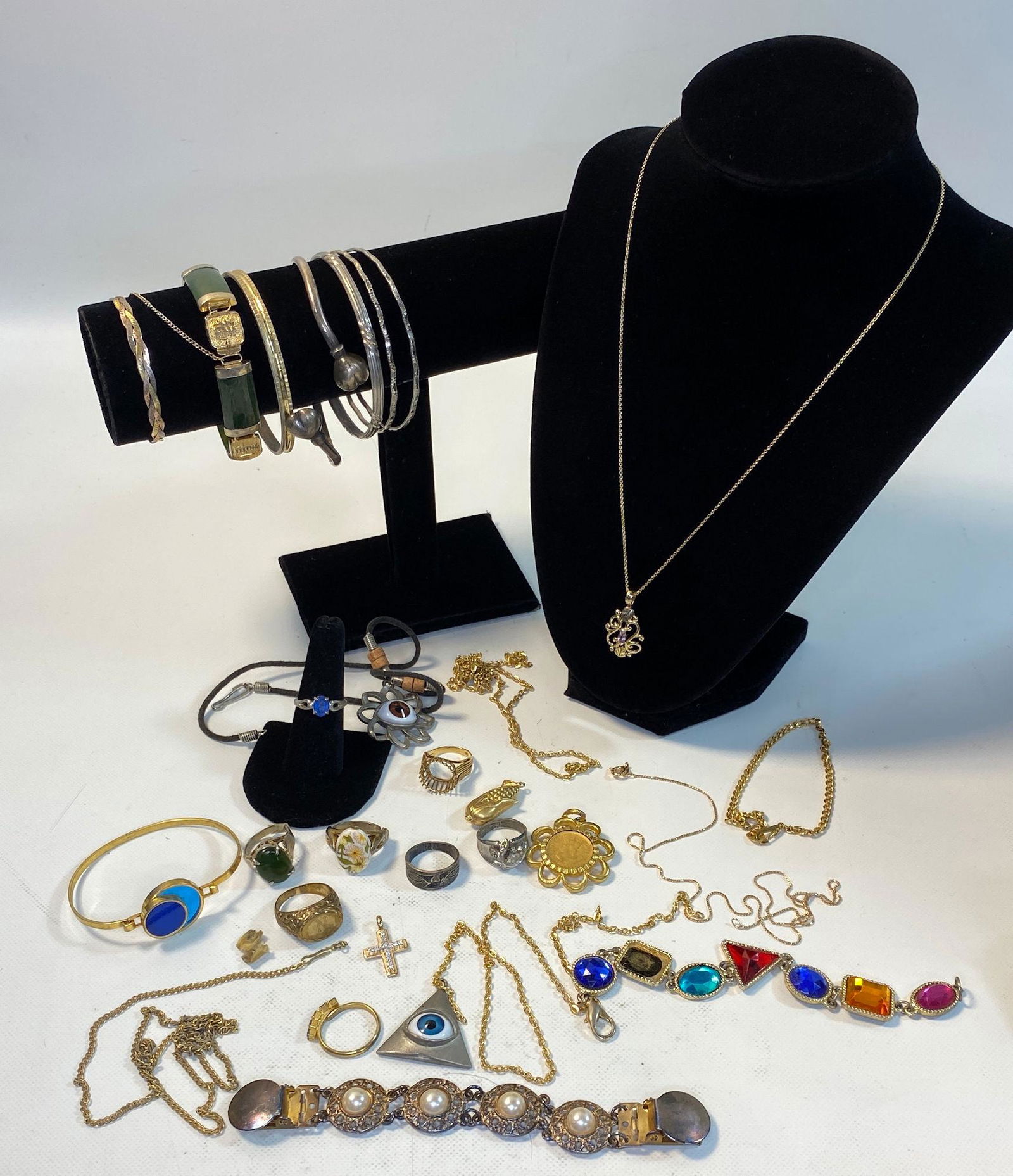 JEWELRY AND ACCESSORIES: JEWELRY AND ACCESSORIES ~ TEN BANGLES/BRACELETS INCLUDING ONE STERLING SILVER CUFF WITH HEART SHAPED ENDS & ONE WOVEN HERRING BONE CHAIN BRACELET WITH LOBSTER CLASP CLOSURE, EIGHT RINGS INCLUDING SIZE