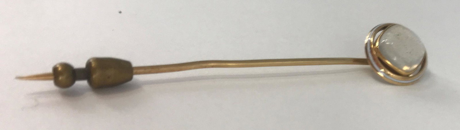 GOLD AND GEMSTONE STICK PIN: GOLD AND GEMSTONE STICK PIN ~ VINTAGE, MADE FROM 14KT YELLOW GOLD (STAMPED AND TESTED), 2.5" IN LENGTH. UNSIGNED. MOONSTONE CABOCHON CENTER STONE IN OPENWORK MOUNTING. 2.5 GRAMS TW.