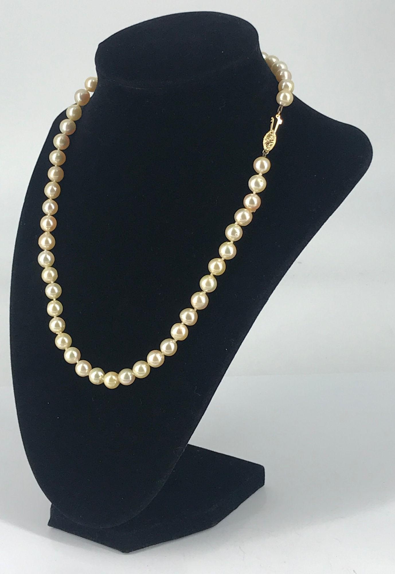 CULTURED PEARL NECKLACE: CULTURED PEARL NECKLACE ~ APPROX 18" IN LENGTH, DOUBLE KNOTTED SEMI-BAROQUE CHAMPAGNE COLORED PEARLS WITH GOOD LUSTER AND MODERATE BLEMISHES, 14KT YELLOW GOLD FISHHOOK CLASP CLOSURE STAMPED AND TESTED