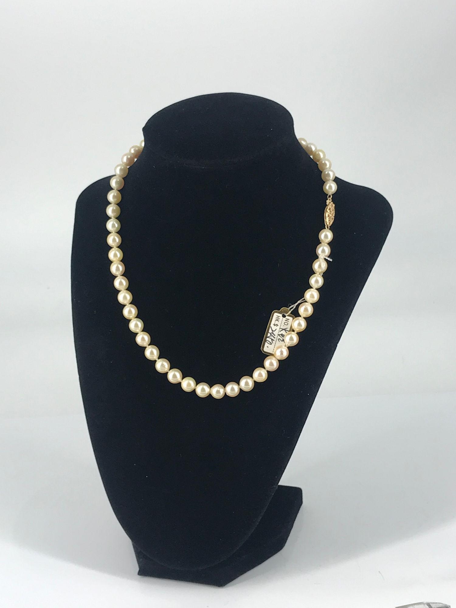 CULTURED PEARL NECKLACE: CULTURED PEARL NECKLACE ~ APPROX. 16" IN LENGTH, DOUBLE KNOTTED SEMI ROUND CHAMPAGNE/CREAM COLORED PEARLS, GOOD LUSTER WITH MODERATE BLEMISHES 14KT YELLOW GOLD FISHHOOK CLASP CLOSURE, STAMPED AND TEST