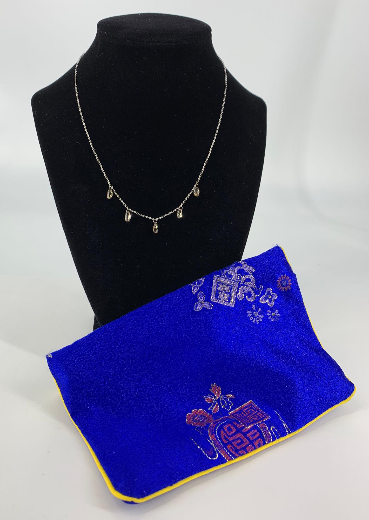DANCING DIAMOND PLATINUM NECKLACE WITH BLUE POUCH (1 of 6)