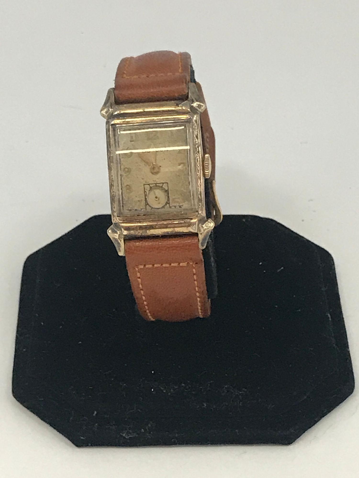 BULOVA WRIST WATCH: BULOVA WRIST WATCH ~ VINTAGE AGE. BROWN LEATHER BAND. WORN CONDITION. FACE DAMAGED. WINDS AND SETS BUT DOES NOT TICK AT TIME OF LISTING. 17-JEWEL MOVEMENT. STERLING/STAINLESS CASE BACK. NUMBERED 31922