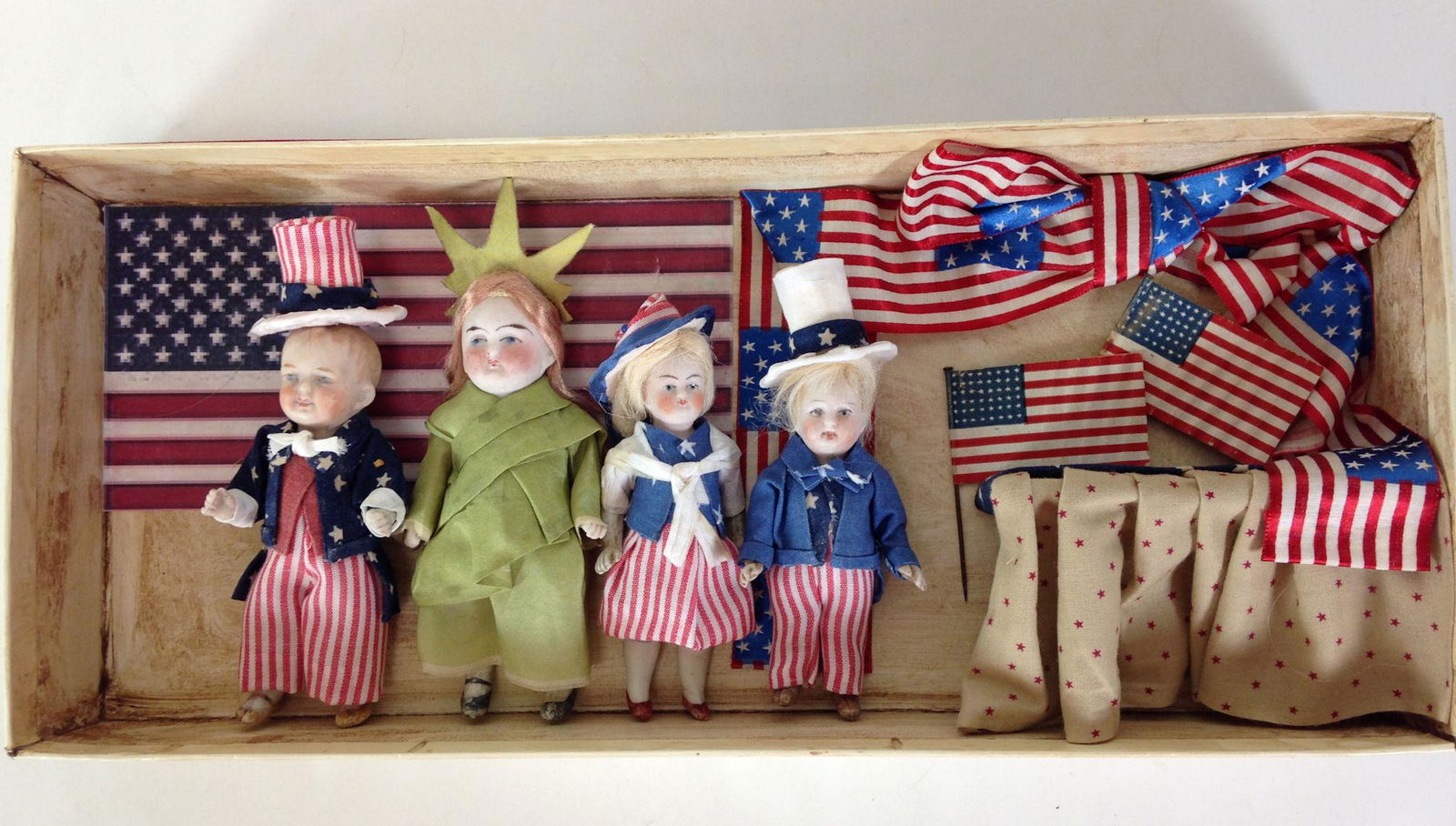 HOMEMADE PATRIOTIC BOX WITH (4) ALL BISQUE DOLLS. (1 of 3)