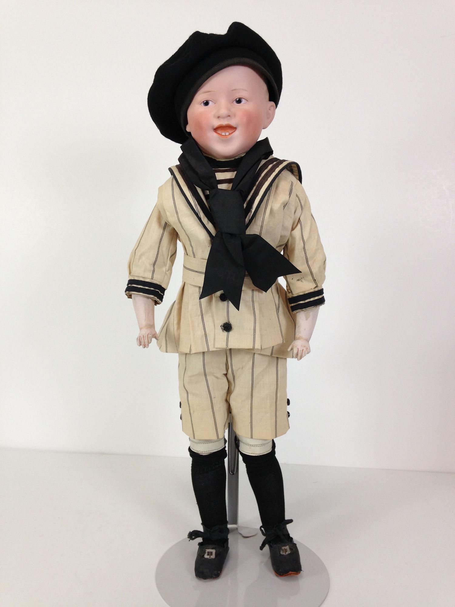 21" BISQUE SHOULDER HEAD MOST LIKELY LAUGHING HEUBACH: 21" BISQUE SHOULDER HEAD MOST LIKELY LAUGHING HEUBACH MARKED "GERMANY". MOLDED AND PAINTED HAIR, INTAGLIO EYES AND OPEN/CLOSED MOUTH WITH TWO MOLDED LOWER TEETH. ON KID BODY WITH BISQUE LOWER ARMS AND