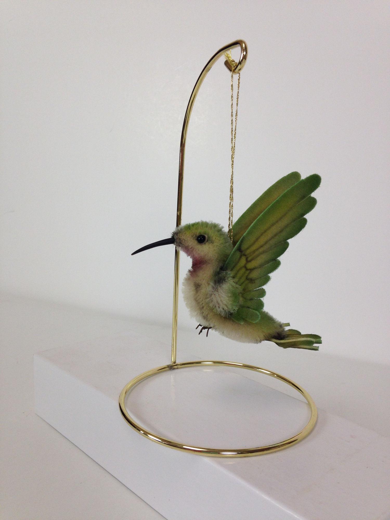 4" LONG R. JOHN WRIGHT HUMMING BIRD COLLECTION "RUBY".: 4" LONG R. JOHN WRIGHT HUMMING BIRD COLLECTION "RUBY". MOHAIR PLUSH WITH FELT AND ORGANDY WINGS, GLASS EYES AND BRONZE FEET. COMES IN ORIGINAL TRIANGULAR BOX WITH COA; LTD ED. #497/500. COMES WITH ORN