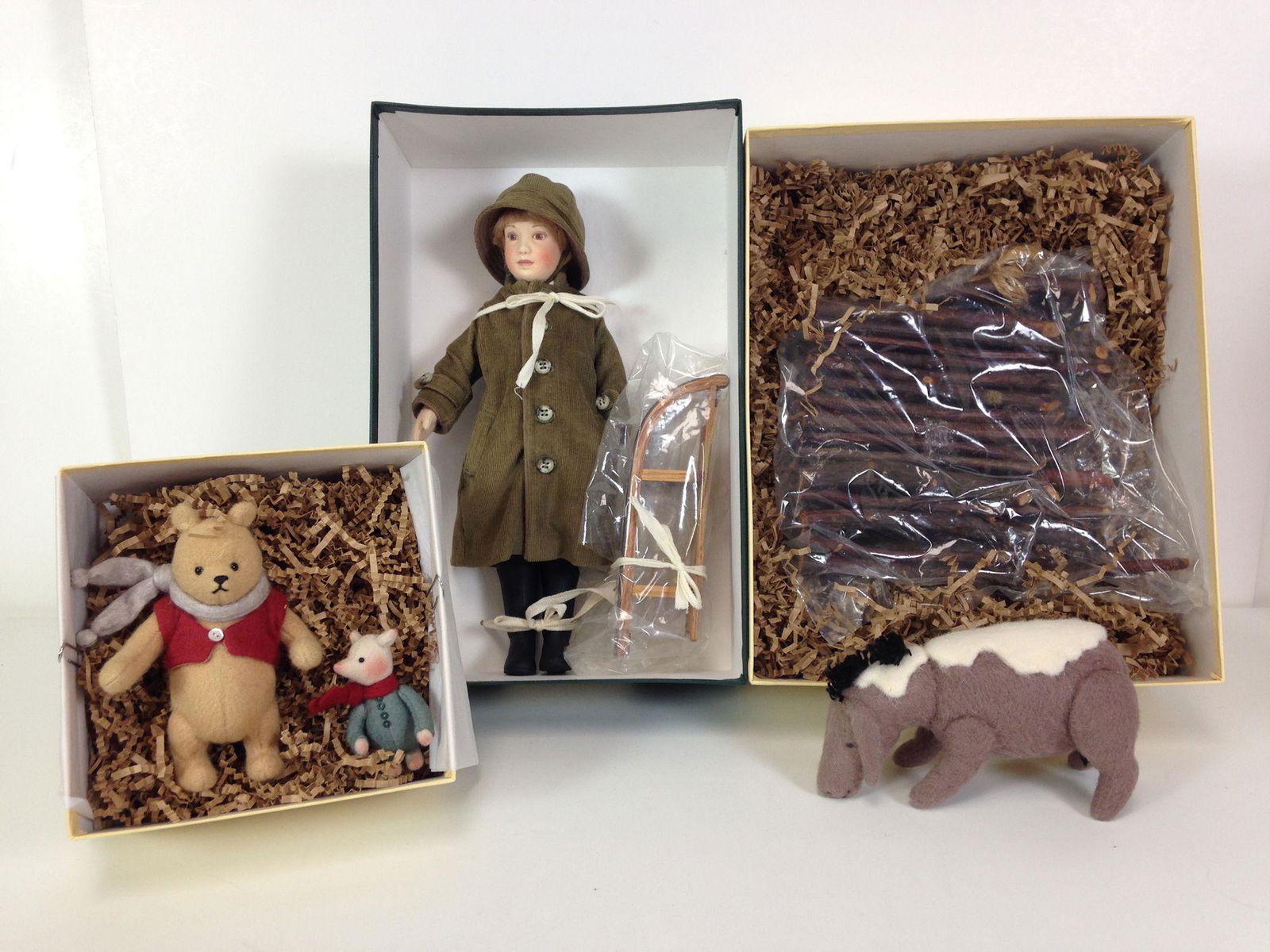 SET R. JOHN WRIGHT CLASSIC WINNIE-THE-POOH MADE: SET R. JOHN WRIGHT CLASSIC WINNIE-THE-POOH MADE EXCLUSIVELY FOR FAO SCHWARZ. INCLUDES "WINTERTIME POOH AND PIGLET", "WINTERTIME CHRISTOPHER ROBIN" AND "WINTERTIME EEYORE". MOLDED AND JOINTED WOOL FELT