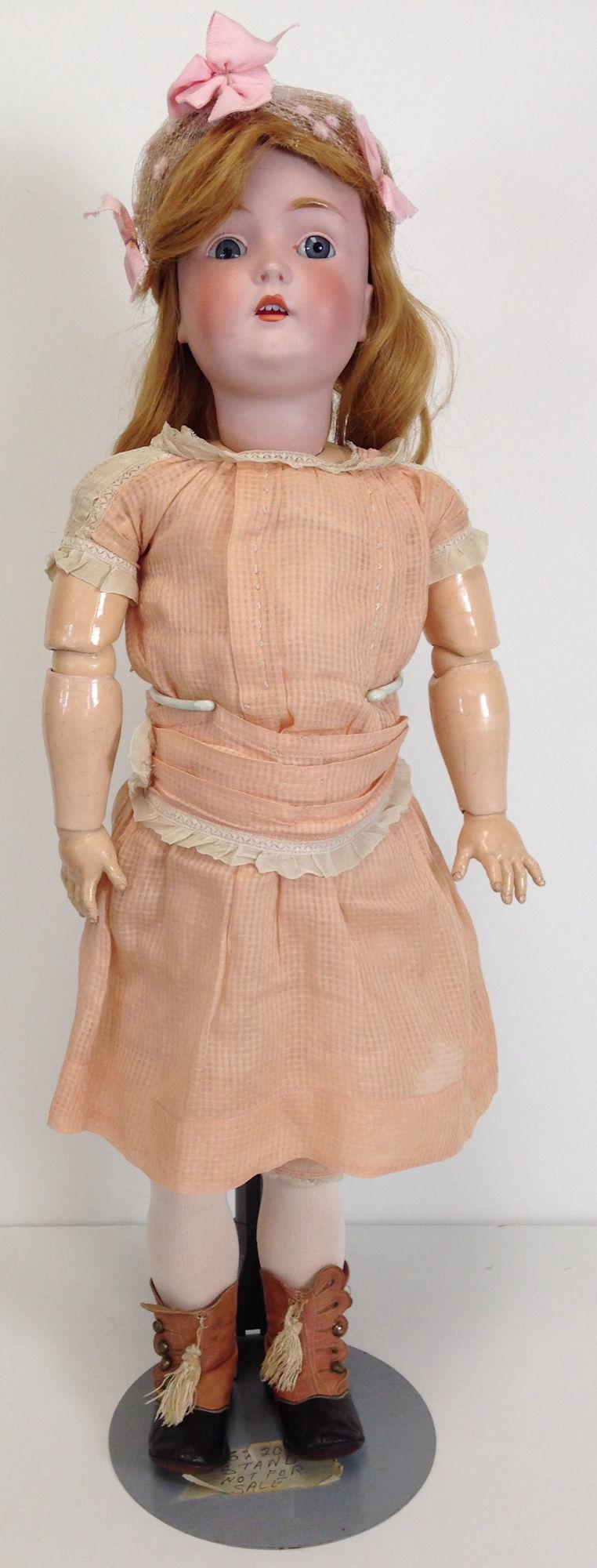 29Â½" KESTNER 171 BISQUE SOCKET HEAD CHILD. HUMAN HAIR: 29½" KESTNER 171 BISQUE SOCKET HEAD CHILD. HUMAN HAIR WIG, GLASS SLEEP EYES AND OPEN MOUTH WITH TEETH. ON COMPOSITION AND WOOD BABY BODY WEARING PEACH DRESS AND ANTIQUE SHOES.