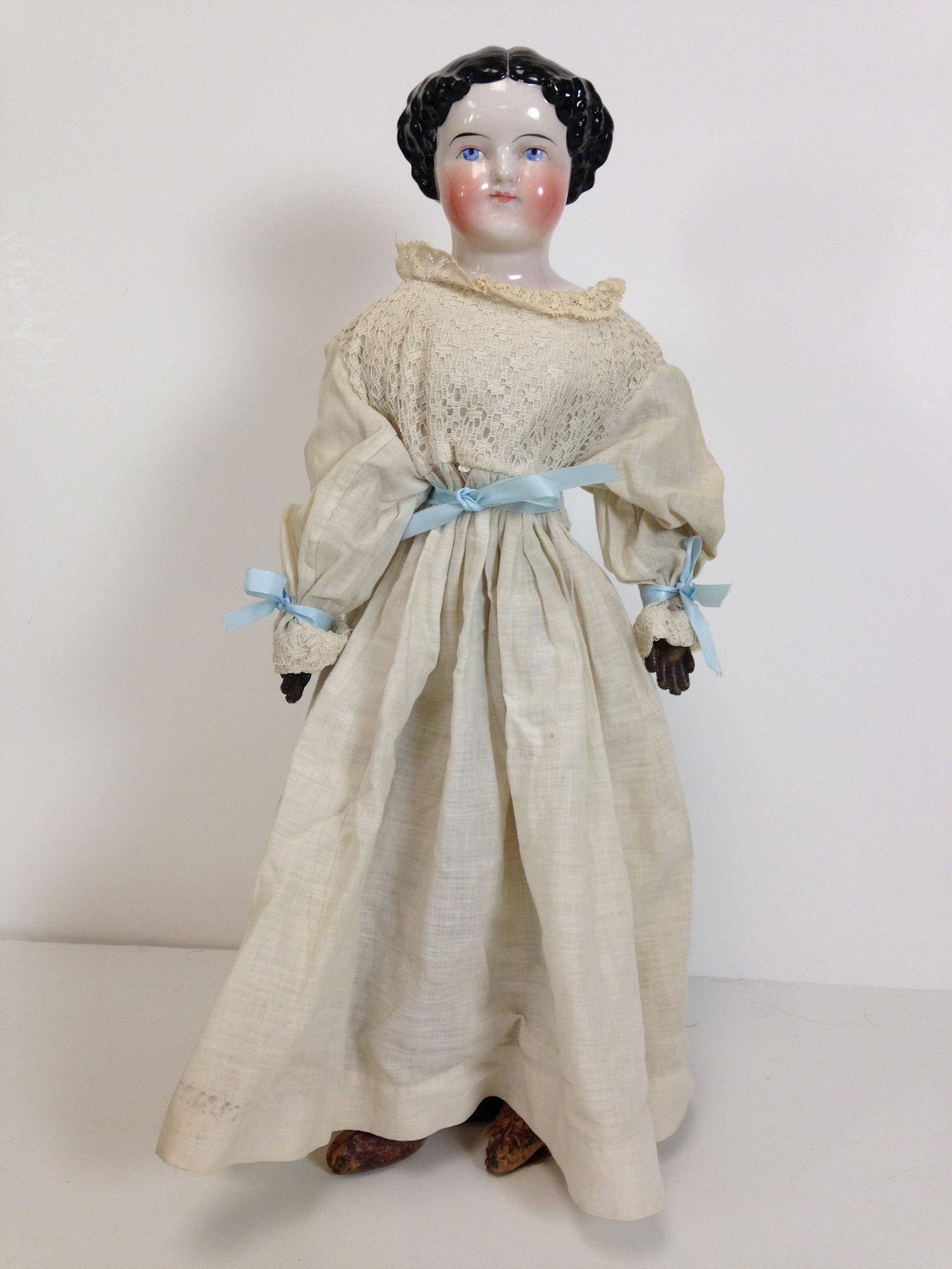 19" FLAT TOP CHINA HEAD DOLL ON CLOTH BODY WITH LEATHER (1 of 5)