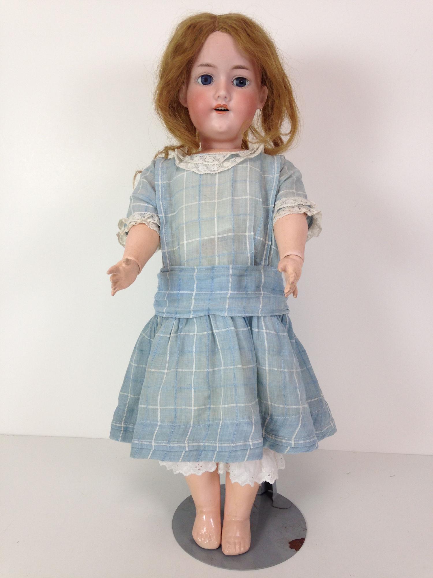 21" A.M. 390 BISQUE SOCKET HEAD CHILD. ANTIQUE HUMAN: 21" A.M. 390 BISQUE SOCKET HEAD CHILD. ANTIQUE HUMAN HAIR WIG, GLASS SLEEP EYES WITH LASHES AND OPEN MOUTH WITH TEETH. ON SPRING JOINTED COMPOSITION BODY WEARING VINTAGE BLUE & WHITE DRESS.