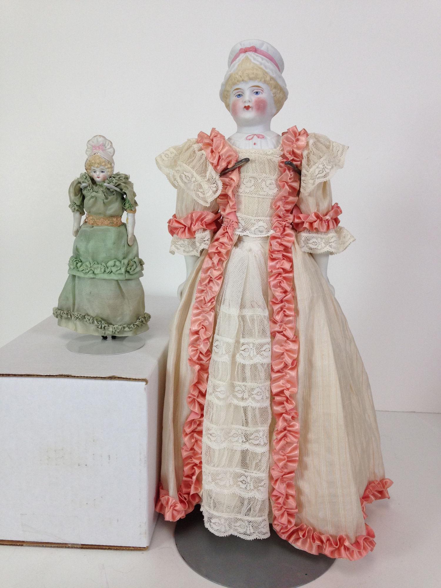 (2) UNTINTED BISQUE BONNET SHOULDER HEAD DOLLS. (1 of 5)