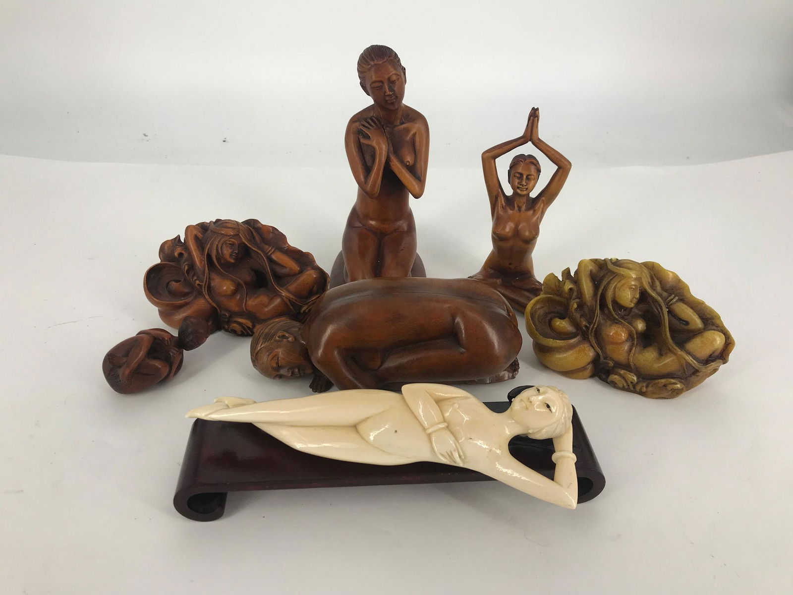 BOX LOT INCLUDING WOOD AND STONE CARVED NUDES. (1 of 1)