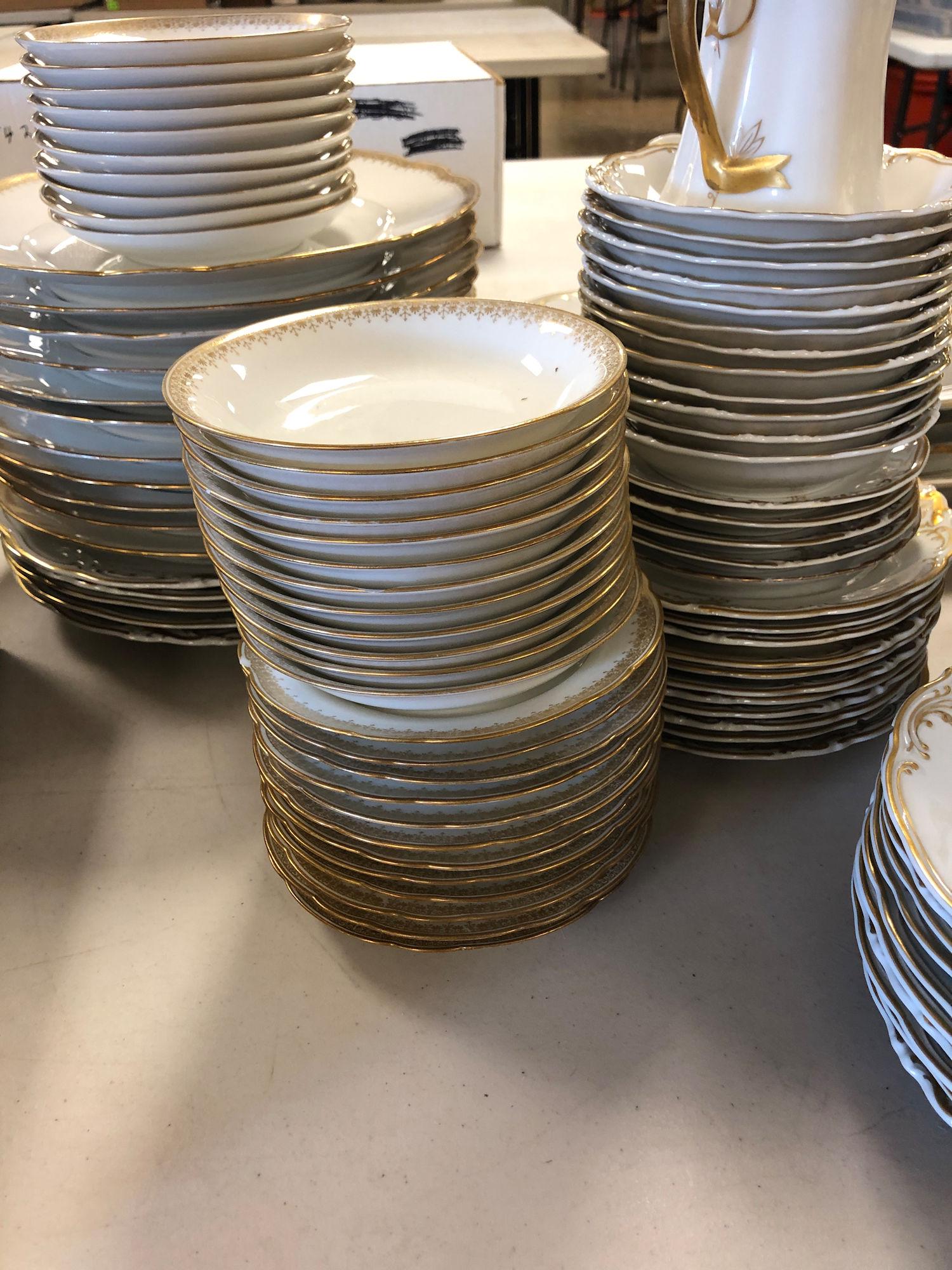112 PC. MIXED PATTERNS WHITE AND GOLD CHINA SET. SOME: 112 PC. MIXED PATTERNS WHITE AND GOLD CHINA SET. SOME MARKED L BERNARDAUD & CO, LIMOGES; SOME MARKED WAKBRZYCH, MADE IN POLAND; SOME MARKED FRAUREUTH, GERMANY. SOME VISIBLE CHIPS AND WORN GOLD.