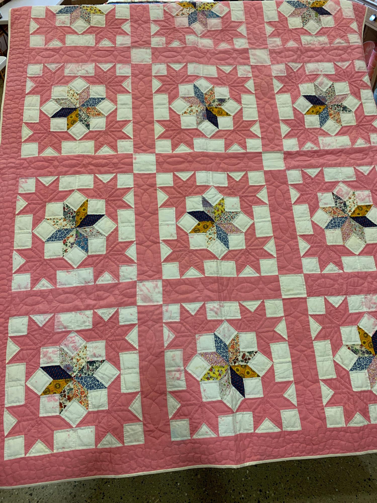 89" X 66" PINK AND WHITE QUILT WITH MULTICOLORED FLOWER (1 of 3)