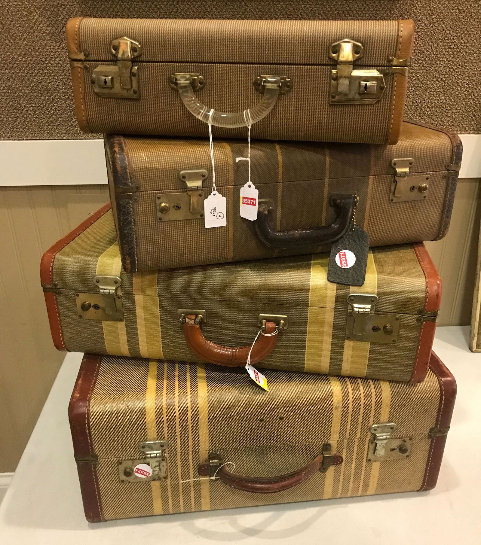 STACK OF 4 VINTAGE SUITCASES, LARGEST MEASURING 21" (1 of 1)