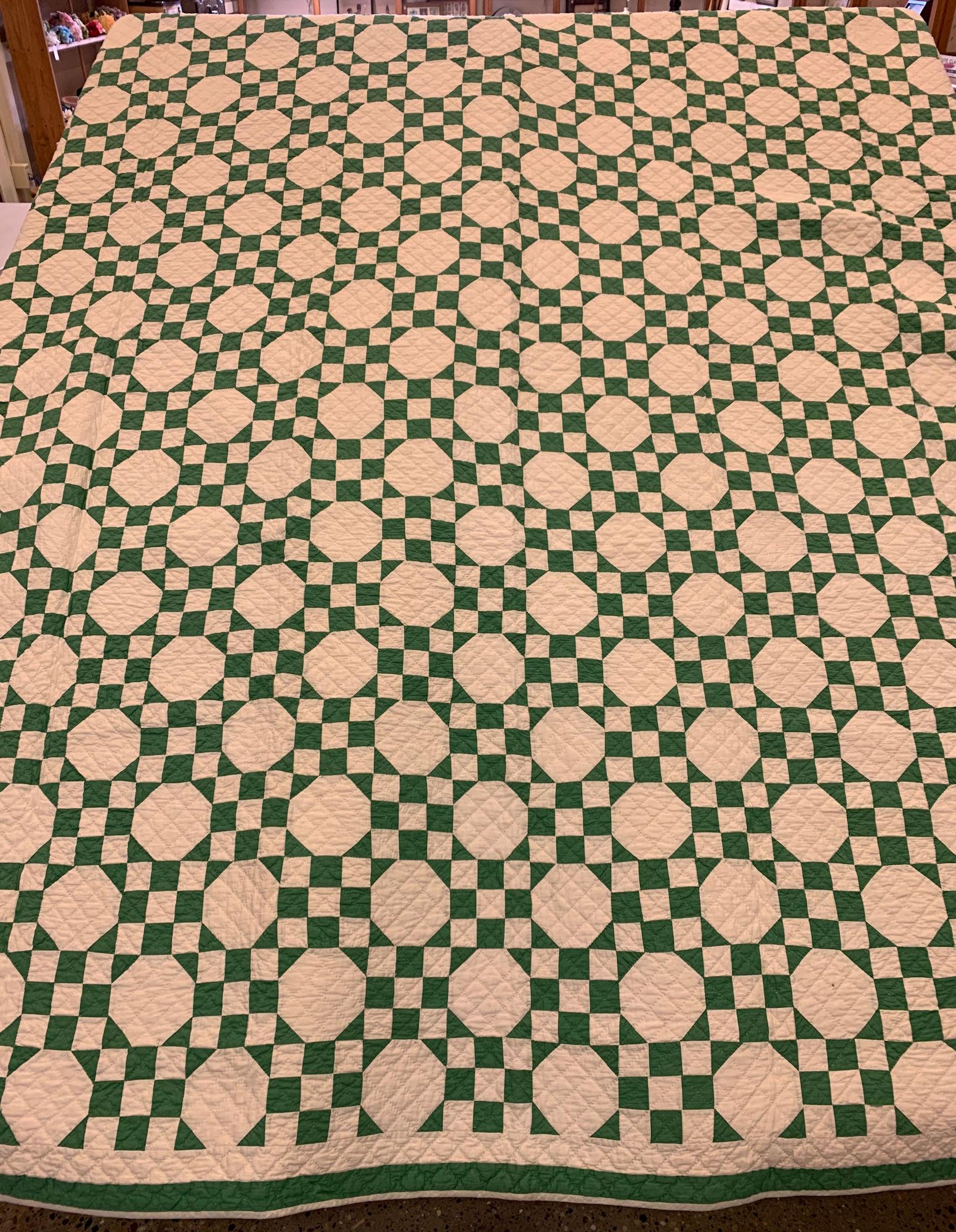 102" X 85" GREEN AND WHITE QUILT. LIGHT STAIN. (1 of 2)