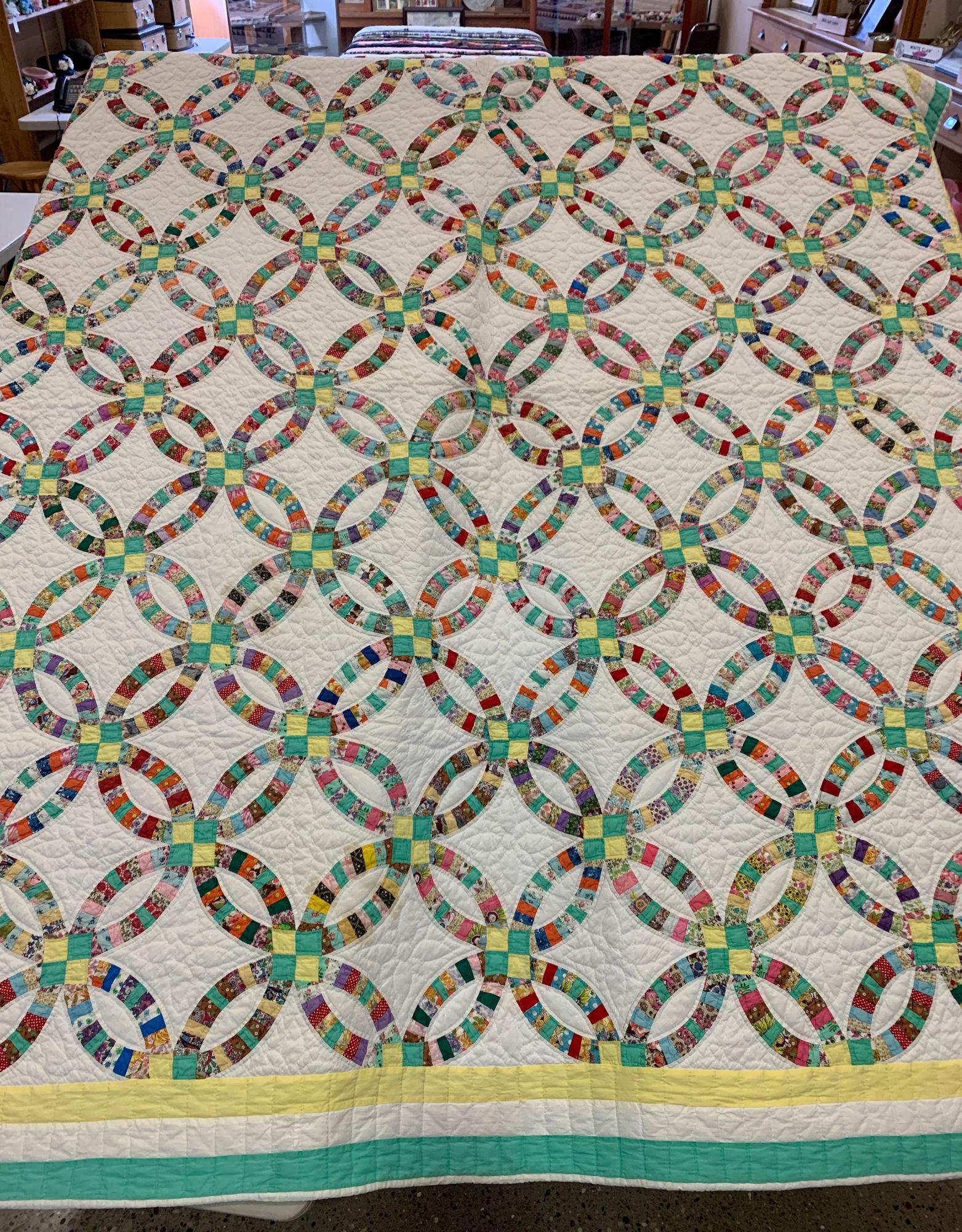 90" X 79" WEDDING RING PATTERN QUILT TRIMMED IN AQUA (1 of 2)
