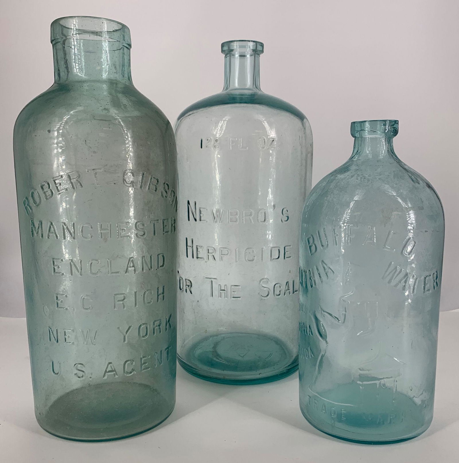 BOX LOT THREE CLEAR GLASS JUGS 10"-13", ONE EMOSSED (1 of 1)