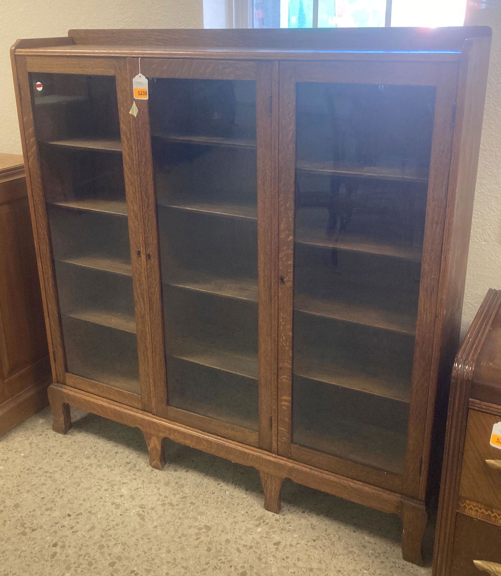 TURN OF THE CENTURY OAK 3-DOOR BOOKCASE. DAMAGE TO (1 of 4)