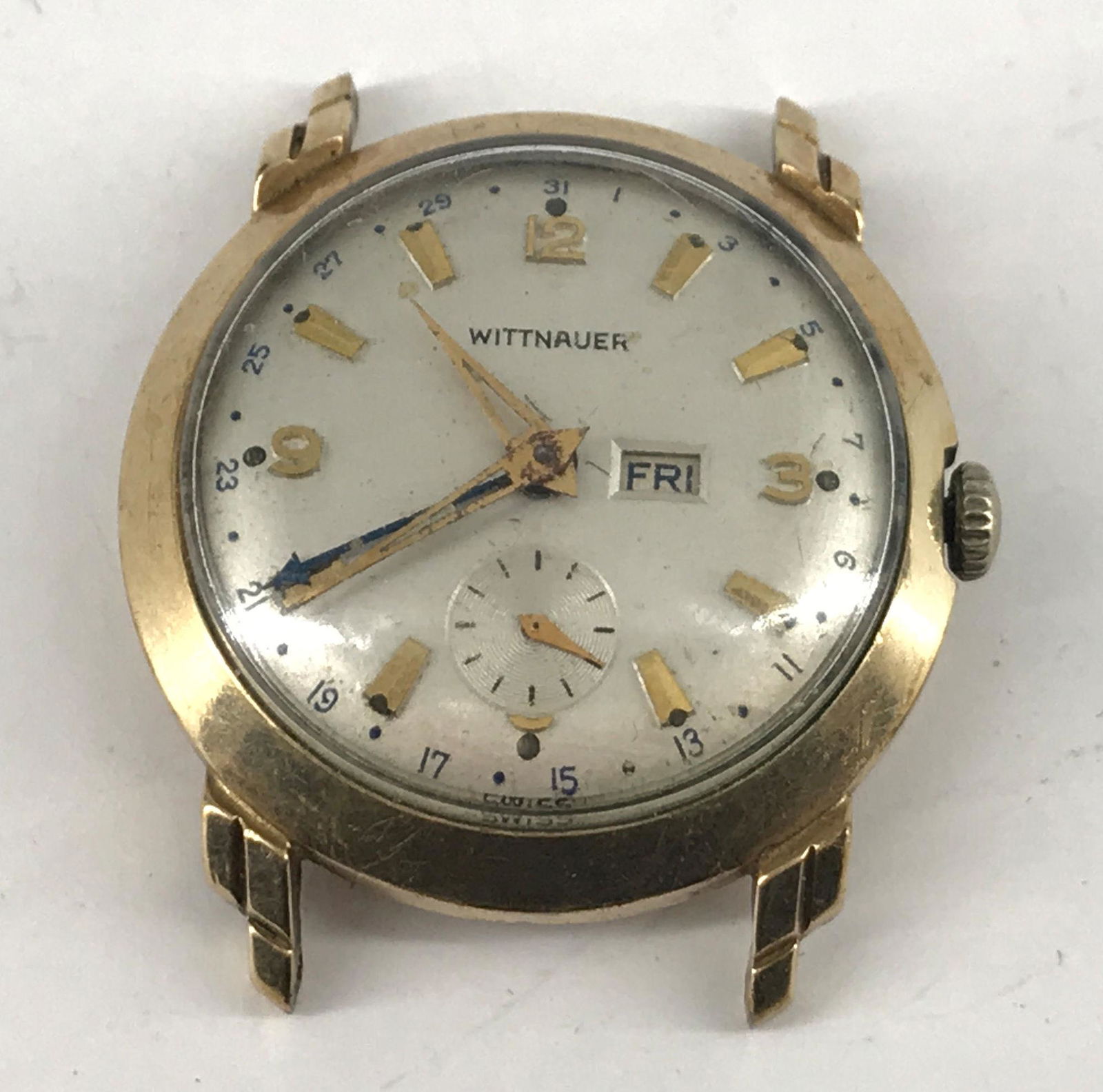 WATCH FACE FROM WITTNAUER: WATCH FACE FROM WITTNAUER ~ VINTAGE MECHANICAL MOVEMENT. 10KT GOLD-FILLED CASE. TAPERED HANDS AND INDICATORS. FACE FEATURES DATE DIAL. WINDS AND SETS AT TIME OF LISTING. SWISS MADE MOVEMENT.