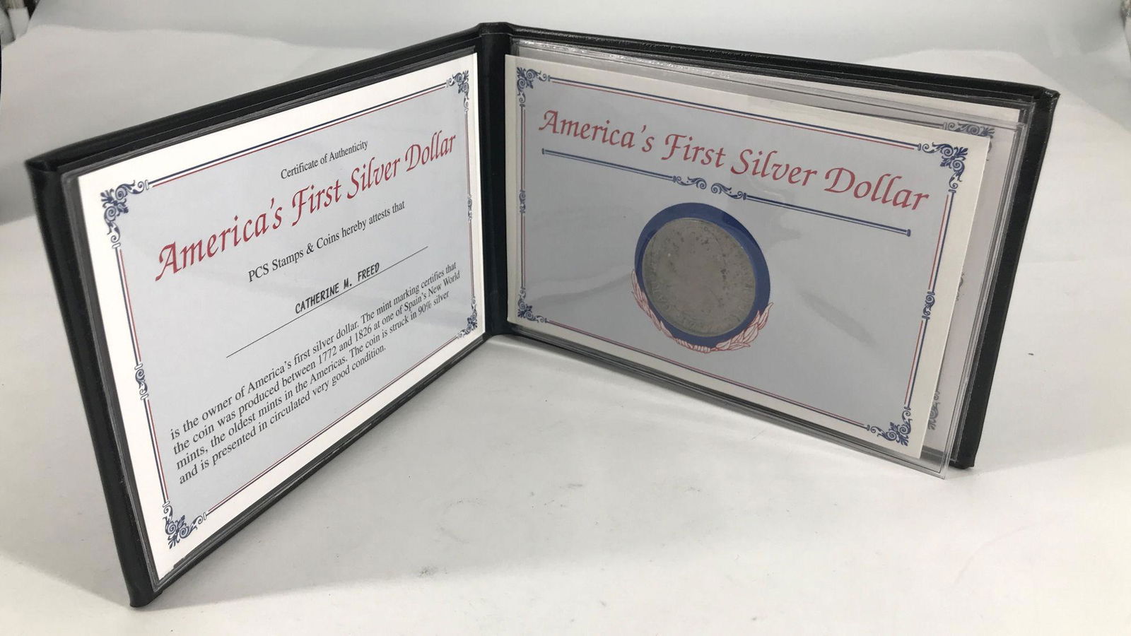 "AMERICA'S FIRST SILVER DOLLAR" FOLIO WITH COIN (1 of 4)