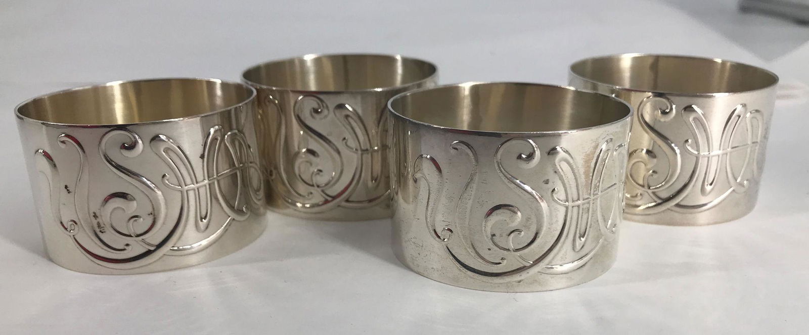 FOUR STERLING SILVER NAPKIN RINGS (1 of 3)