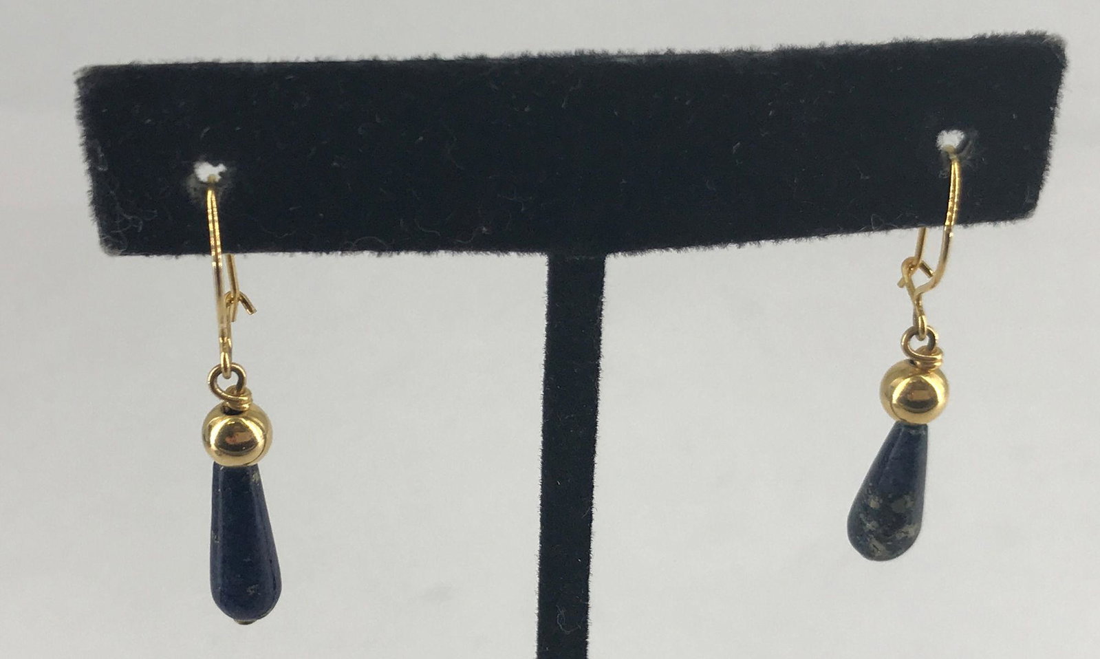 14KT GOLD AND STONE EARRINGS: 14KT GOLD AND STONE EARRINGS ~ PIERCED, DANGLE DESIGN, 14KT YELLOW GOLD (TESTED BUT NOT STAMPED), UNSIGNED, POLISHED OBLONG LAPIS LAZULI STONE DANGLES, POLISHED METAL FINISH. 1.8 GRAMS TW.