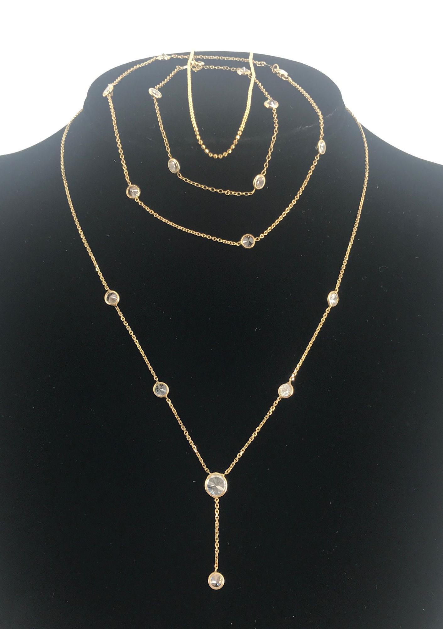 14KT YELLOW GOLD FASHION NECKLACE: 14KT YELLOW GOLD FASHION NECKLACE ~ 20" MATINEE LENGTH BOX CHAIN NECKLACE WITH 0.75" DUAL TONE PENDANT CONTAINING AN OVAL SHAPED TANZANITE CENTER STONE (5MM X 7MM IN SIZE/0.76 CTW) ACCENTED WITH TWELV