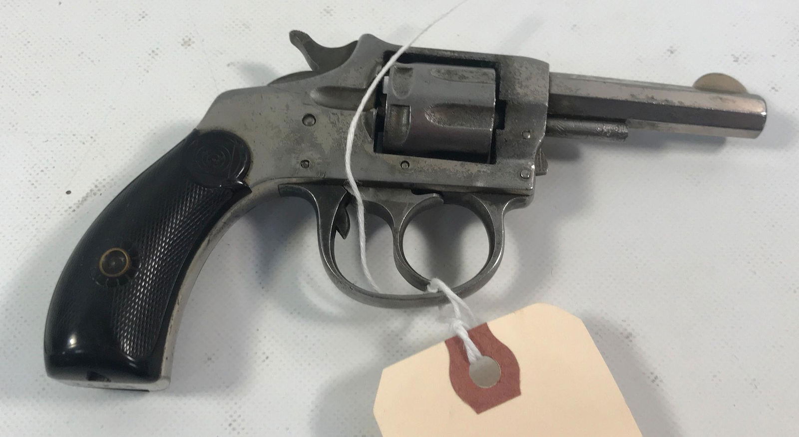 H&R MODEL 1906 .22 CALIBER REVOLVER SN: 24231. BY: H&R MODEL 1906 .22 CALIBER REVOLVER SN: 24231. BY BIDDING ON THIS LOT BUYER ACCEPTS RESPONSIBILTY OF KNOWLEDGE OF STATE AND FEDERAL LAWS FOR RECEIVING THIS ITEM.