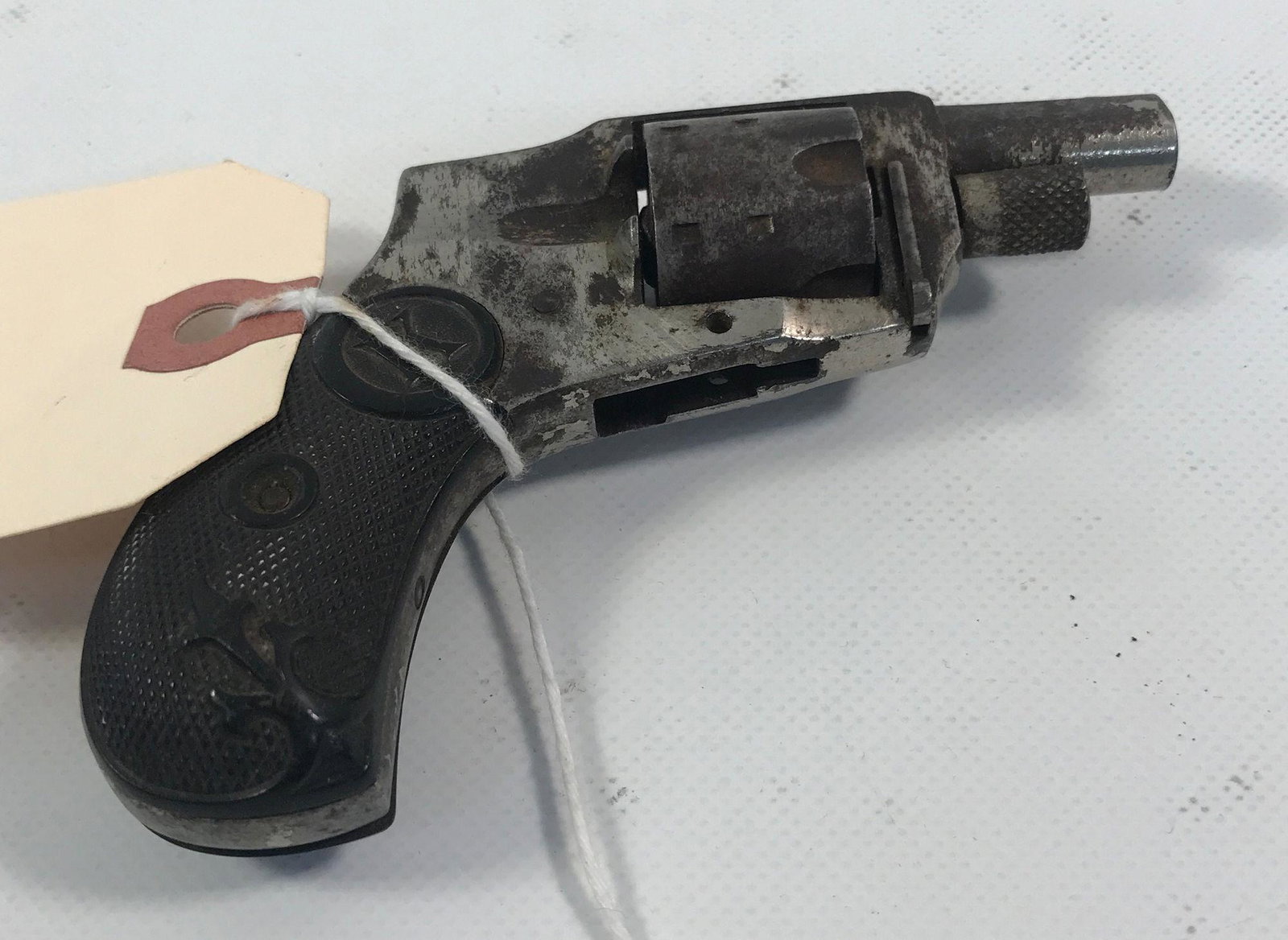 BABY HAMMERLESS .22 CALIBER REVOLVER SN: 899. BY: BABY HAMMERLESS .22 CALIBER REVOLVER SN: 899. BY BIDDING ON THIS LOT BUYER ACCEPTS RESPONSIBILTY OF KNOWLEDGE OF STATE AND FEDERAL LAWS FOR RECEIVING THIS ITEM.