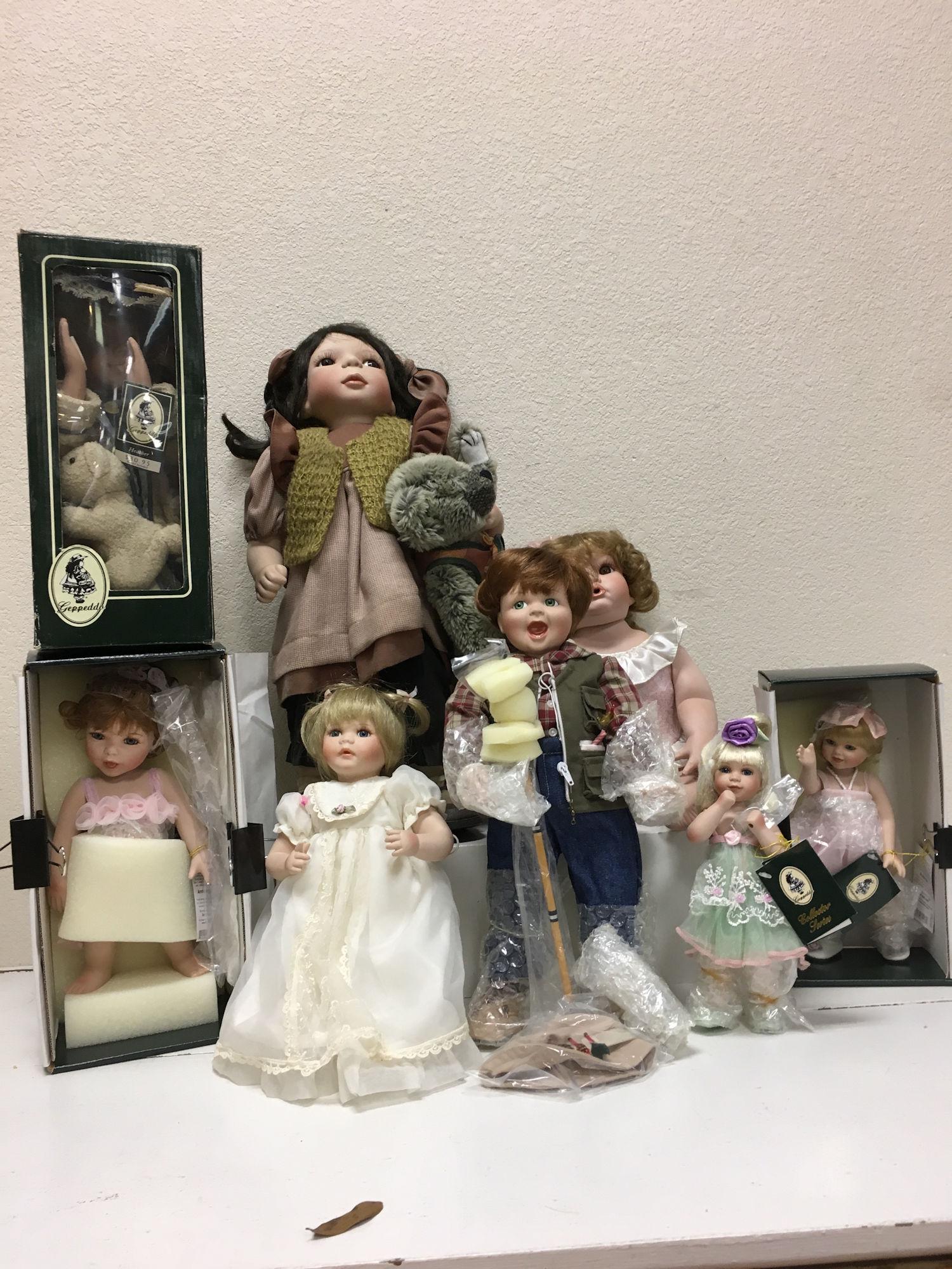 LOT 8 BOXED PORCELAIN DOLLS INCLUDING SEYMOUR MANN AND: LOT 8 BOXED PORCELAIN DOLLS INCLUDING SEYMOUR MANN AND GEPPEDDO. ALL ITEMS SOLD AS IS. CONDITION REPORTS NOT AVAILABLE.