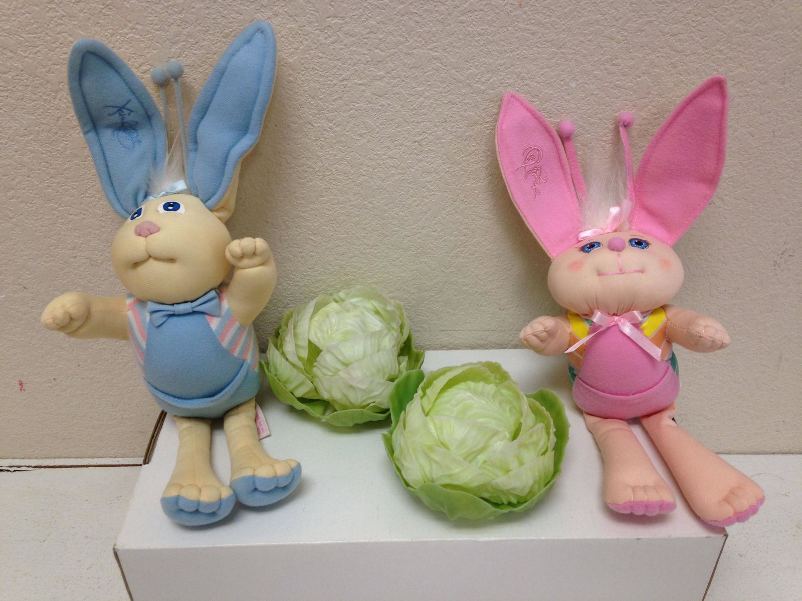 LOT (2) XAVIER ROBERTS BUNNY BEES AND CABBAGES. ALL: LOT (2) XAVIER ROBERTS BUNNY BEES AND CABBAGES. ALL ITEMS SOLD AS IS. CONDITION REPORTS NOT AVAILABLE.