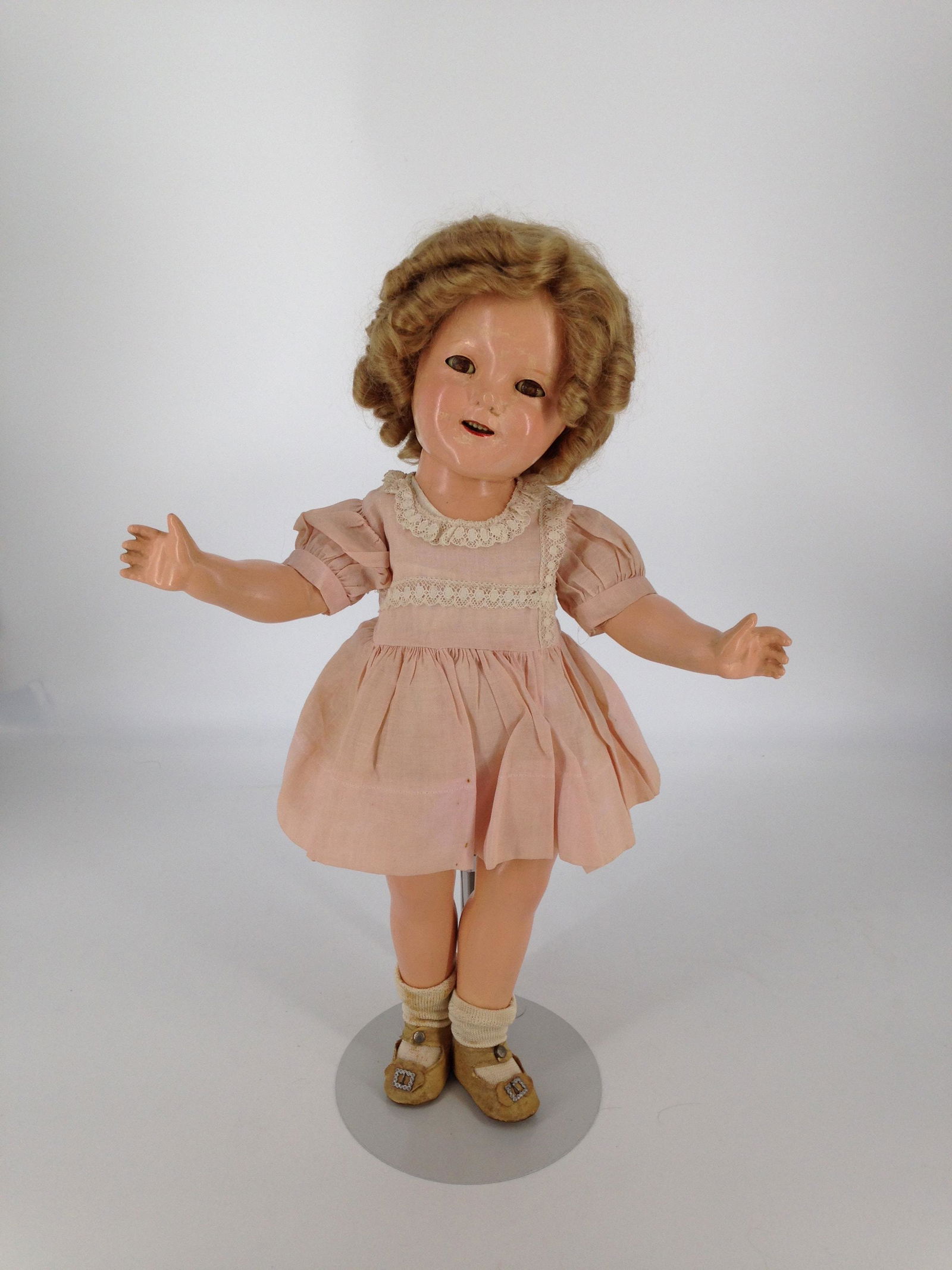 18" VINTAGE ALL COMPOSITION IDEAL SHIRLEY TEMPLE WITH: 18" VINTAGE ALL COMPOSITION IDEAL SHIRLEY TEMPLE WITH REPLACED MOHAIR WIG AND WEARS VINTAGE PINK DRESS, UNDERGARMENT, SOCKS AND ONE-SNAP SHOES.