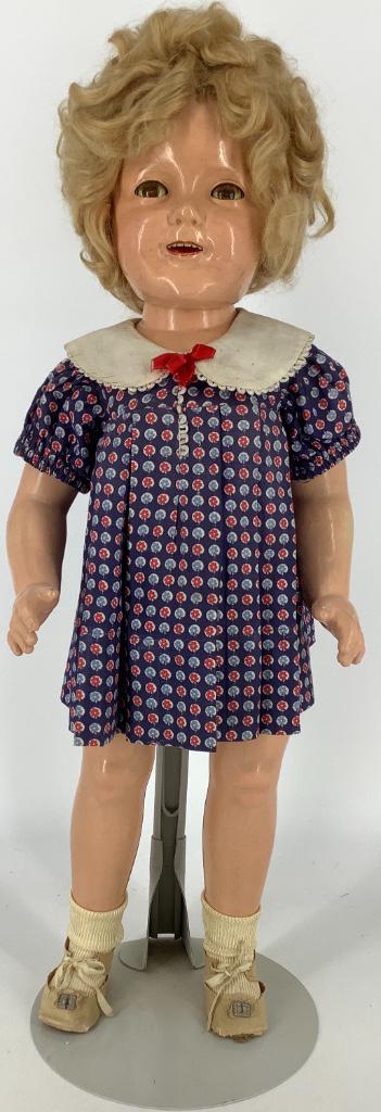 25" IDEAL COMPOSITION SHIRLEY TEMPLE. HEAD AND TORSO: 25" IDEAL COMPOSITION SHIRLEY TEMPLE. HEAD AND TORSO MARKED AS SHOWN, MOHAIR WIG MAY BE A REPLACEMENT, FLIRTY EYES, OPEN MOUTH WITH TEETH, ON FIVE-PIECE COMPOSITION BODY. DOLL WEARS UNTAGGED DRESS THA