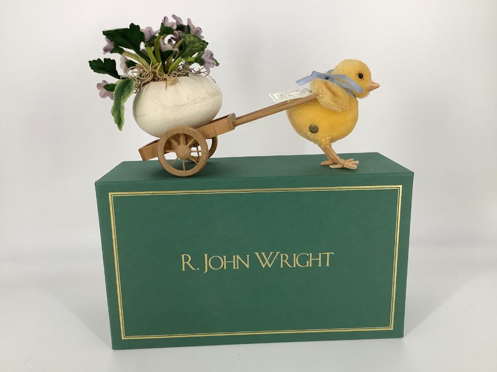R. John Wright "Spring Delivery". Mohair Chick pulling: R. John Wright "Spring Delivery". Mohair Chick pulling a cart with a felt egg full of flowers.Chick has felt beak and legs, glass eyes and paper tag. 7 1/2" overall length. Limited Edition No. 6/250,c