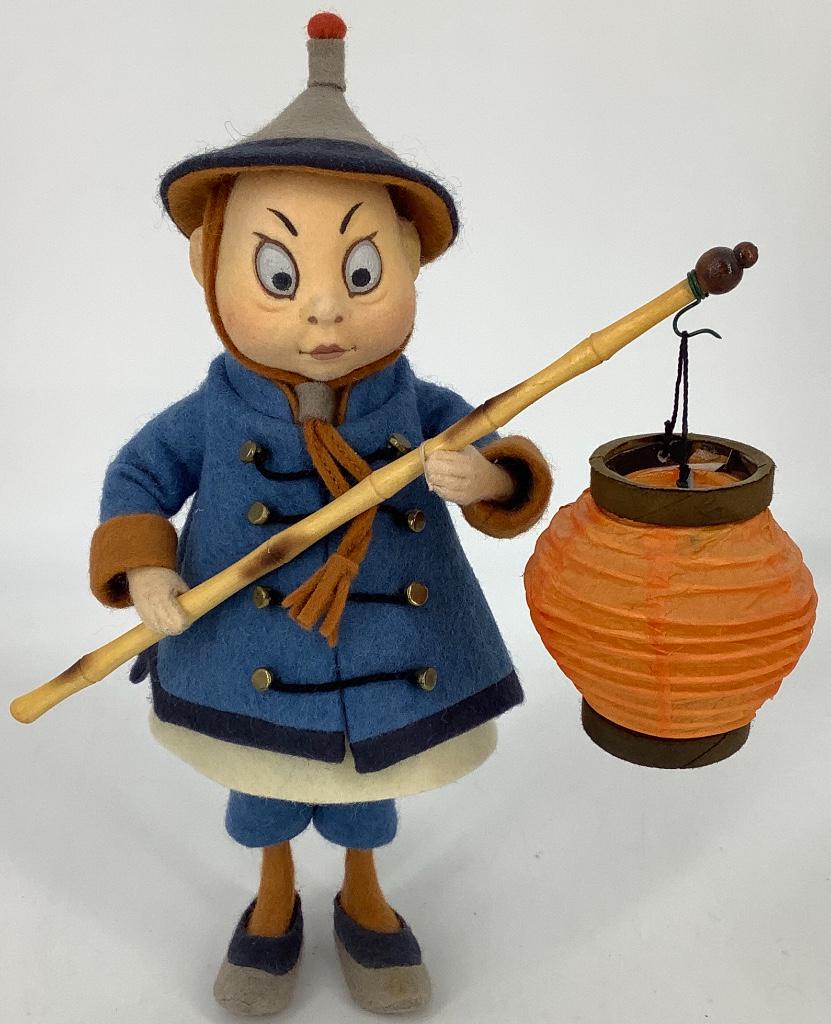 8" R. John Wright's Palmer Cox "Brownie Chinaman". All: 8" R. John Wright's Palmer Cox "Brownie Chinaman". All felt with molded and painted swivel head, mohair queue, wrapped wire arms, molded torso and legs, dressed in felt costume. He carries a "bamboo"