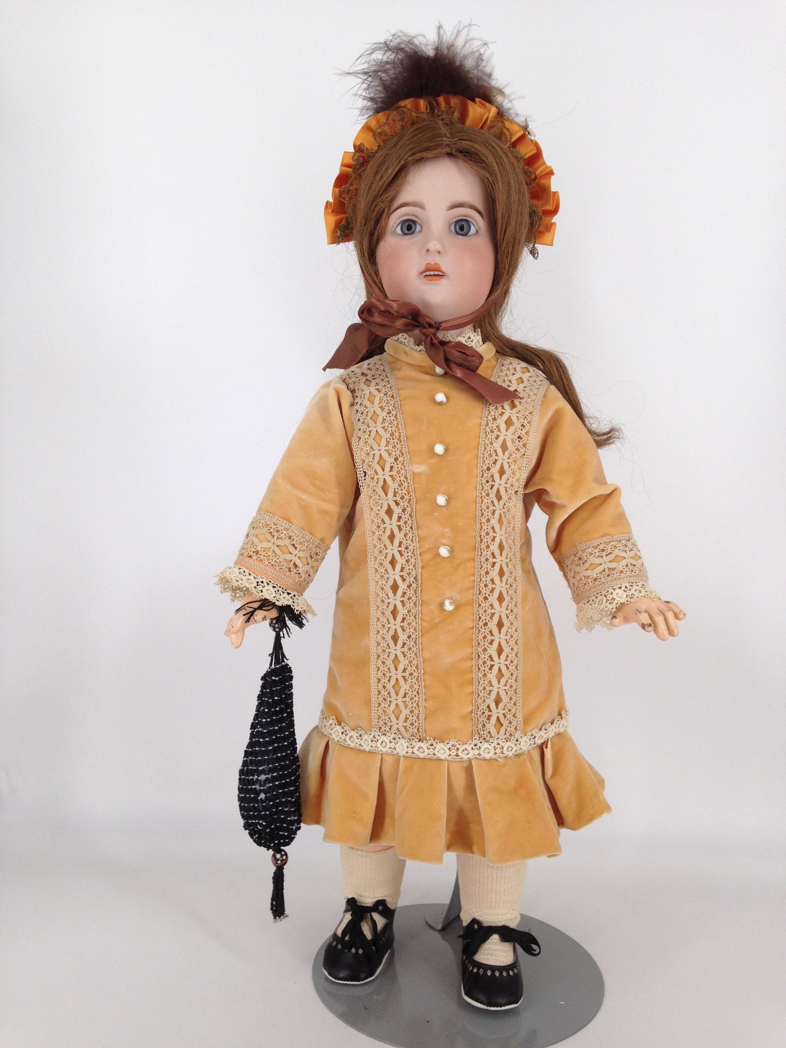 22" 1907 TÃŠTE JUMEAU BISQUE SOCKET HEAD GIRL. MARKED: 22" 1907 TÃŠTE JUMEAU BISQUE SOCKET HEAD GIRL. MARKED AS SHOWN, HUMAN HAIR WIG OVER CORK PATE, STATIONARY GLASS PAPERWEIGHT EYES, PIERCED EARS, OPEN MOUTH WITH TEETH, ON FULLY JOINTED COMPOSITION BO