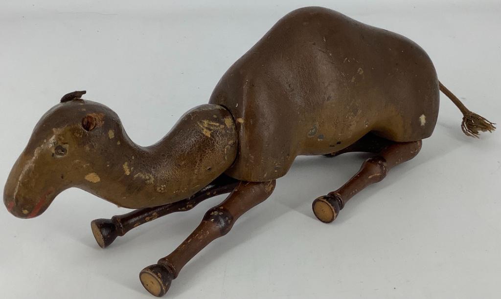 Schoenhut full size camel. 7" tall, painted eyes: Schoenhut full size camel. 7" tall, painted eyes retains one original ear and rope tail. Stringing is loose, overall wear, no repaint.
