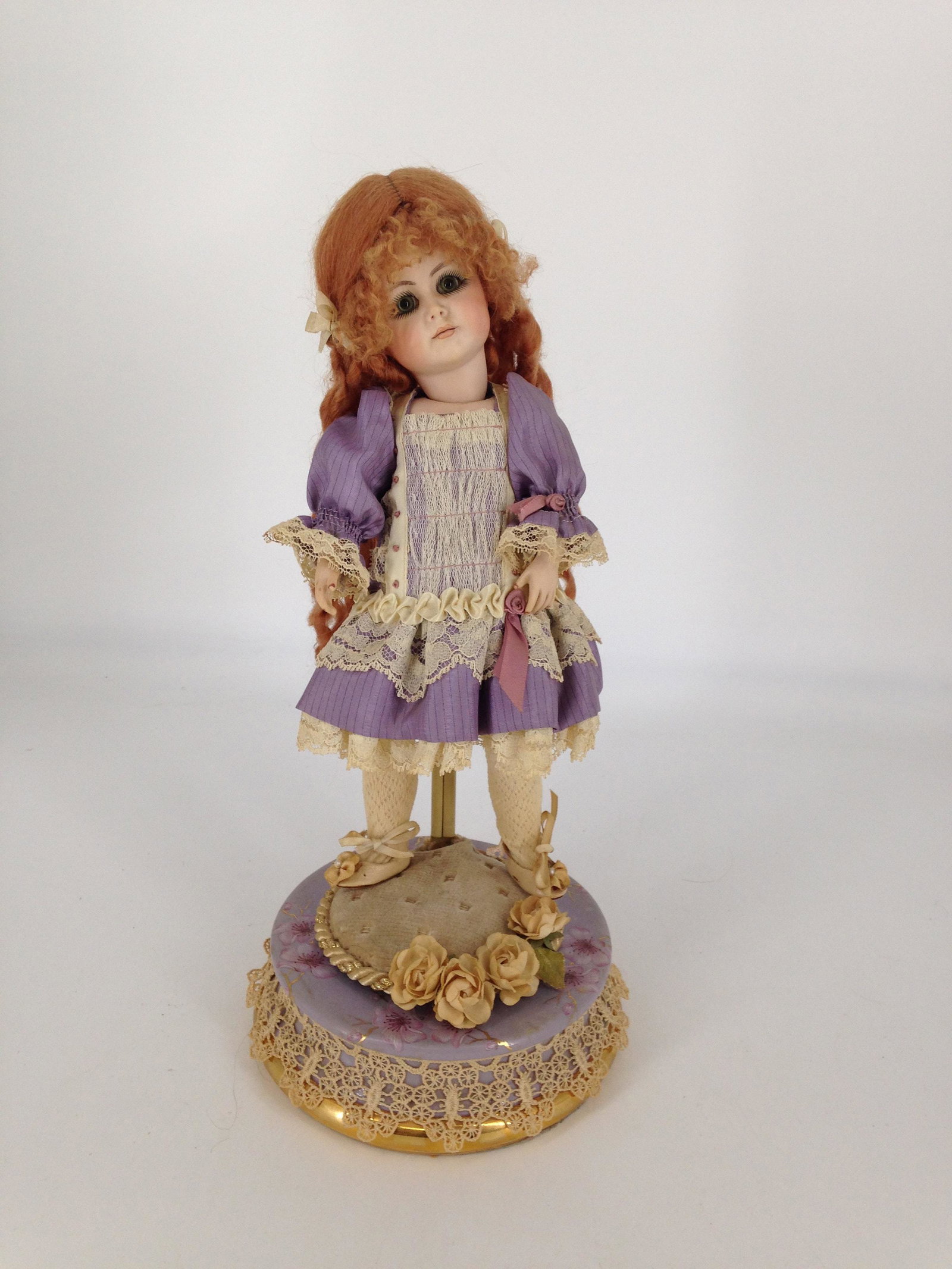 11" PORCELAIN ARTIST DOLL ON TURNING MUSIC BOX THAT: 11" PORCELAIN ARTIST DOLL ON TURNING MUSIC BOX THAT PLAYS "LAURA'S THEME"