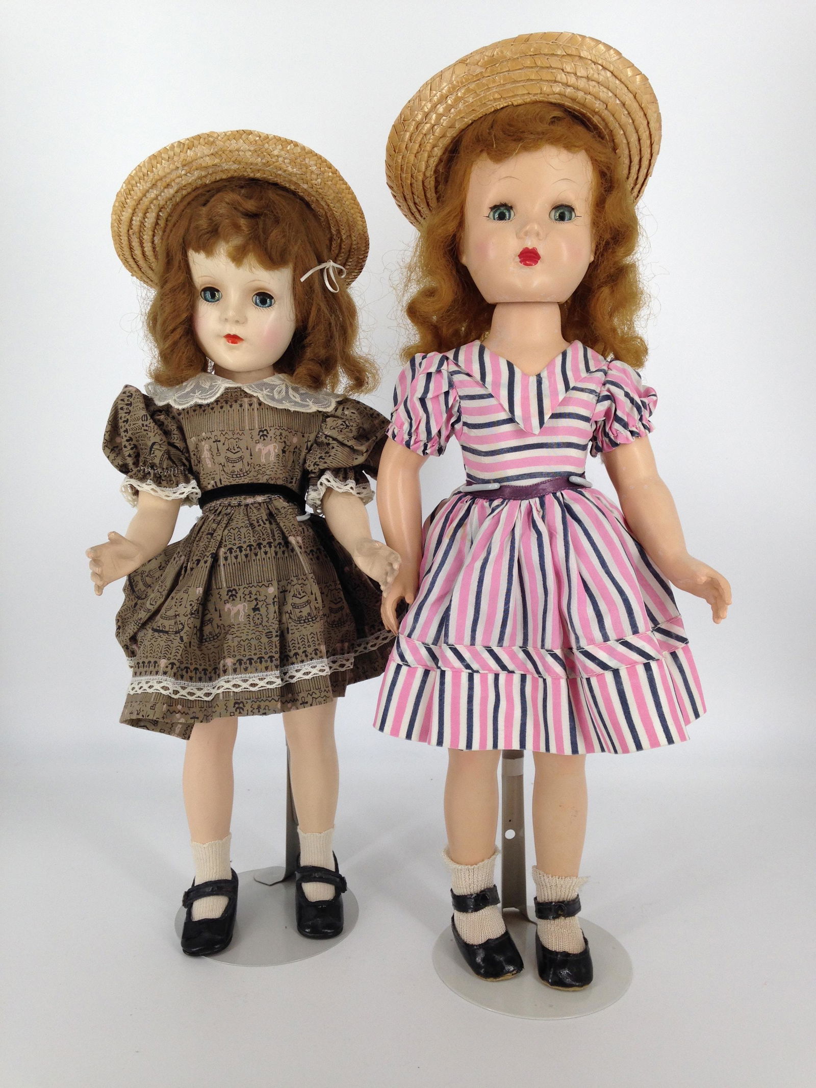 (2) VINTAGE HARD PLASTIC WALKERS INCLUDING 19" EFFANBEE: (2) VINTAGE HARD PLASTIC WALKERS INCLUDING 19" EFFANBEE HONEY WALKER AND 17" SWEET SUE WALKER (UNMARKED). HONEY WEARS VINTAGE PINK AND BLACK STRIPE DRESS AND MATCHING UNDERGARMENT AND BLACK SHOES AND